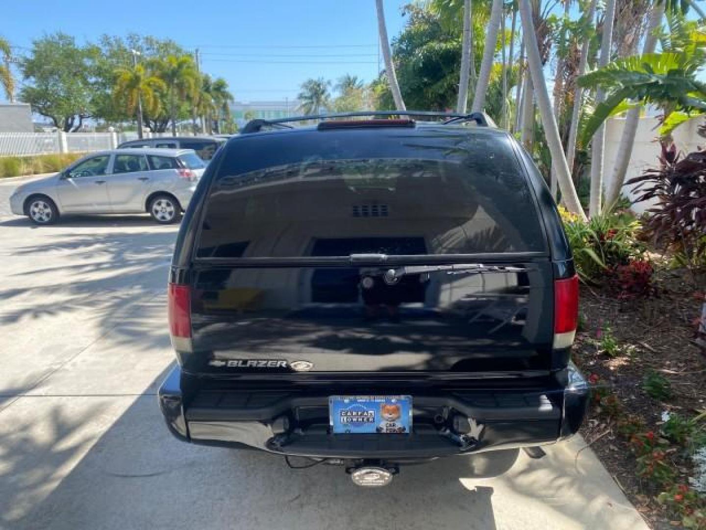 2002 Onyx Black /Medium Gray Chevrolet Blazer LS 4WD LOW MILES 35,402 (1GNDT13W62K) with an 4.3L Vortec 1000 SFI V6 Engine engine, Automatic transmission, located at 4701 North Dixie Hwy, Pompano Beach, FL, 33064, (954) 422-2889, 26.240938, -80.123474 - OUR WEBPAGE FLORIDACARS1.COM HAS OVER 100 PHOTOS AND FREE CARFAX LINK 2002 CHEVROLET BLAZER LS VIN: 1GNDT13W62K130832 1 G N D T 1 3 W 6 2 K 1 3 0 8 3 2 4 DOOR WAGON/SPORT UTILITY 4.3L V6 F OHV 12V GASOLINE REAR WHEEL DRIVE W/ 4X4 Top Features 4WD/AWD Cloth Seats Alloy Wheels Tow Hitch Basic Features - Photo#73