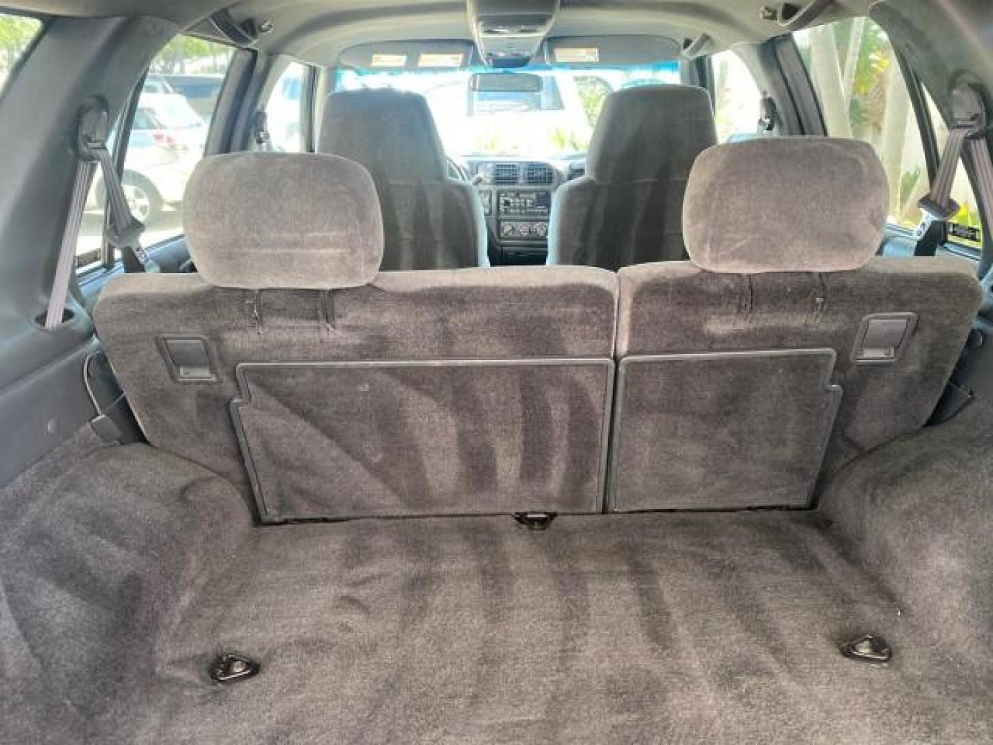 2002 Onyx Black /Medium Gray Chevrolet Blazer LS 4WD LOW MILES 35,402 (1GNDT13W62K) with an 4.3L Vortec 1000 SFI V6 Engine engine, Automatic transmission, located at 4701 North Dixie Hwy, Pompano Beach, FL, 33064, (954) 422-2889, 26.240938, -80.123474 - OUR WEBPAGE FLORIDACARS1.COM HAS OVER 100 PHOTOS AND FREE CARFAX LINK 2002 CHEVROLET BLAZER LS VIN: 1GNDT13W62K130832 1 G N D T 1 3 W 6 2 K 1 3 0 8 3 2 4 DOOR WAGON/SPORT UTILITY 4.3L V6 F OHV 12V GASOLINE REAR WHEEL DRIVE W/ 4X4 Top Features 4WD/AWD Cloth Seats Alloy Wheels Tow Hitch Basic Features - Photo#78