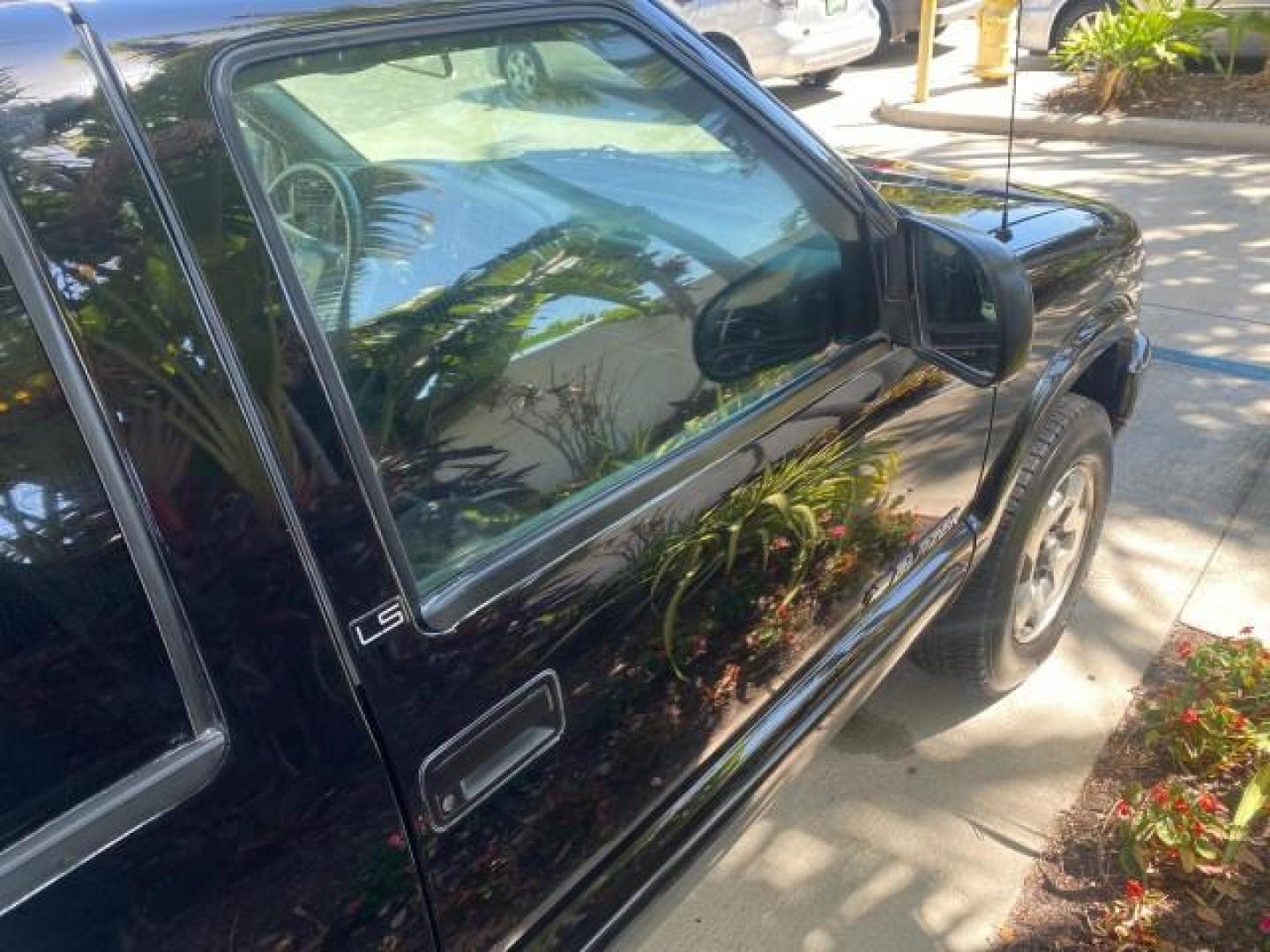 2002 Onyx Black /Medium Gray Chevrolet Blazer LS 4WD LOW MILES 35,402 (1GNDT13W62K) with an 4.3L Vortec 1000 SFI V6 Engine engine, Automatic transmission, located at 4701 North Dixie Hwy, Pompano Beach, FL, 33064, (954) 422-2889, 26.240938, -80.123474 - OUR WEBPAGE FLORIDACARS1.COM HAS OVER 100 PHOTOS AND FREE CARFAX LINK 2002 CHEVROLET BLAZER LS VIN: 1GNDT13W62K130832 1 G N D T 1 3 W 6 2 K 1 3 0 8 3 2 4 DOOR WAGON/SPORT UTILITY 4.3L V6 F OHV 12V GASOLINE REAR WHEEL DRIVE W/ 4X4 Top Features 4WD/AWD Cloth Seats Alloy Wheels Tow Hitch Basic Features - Photo#91