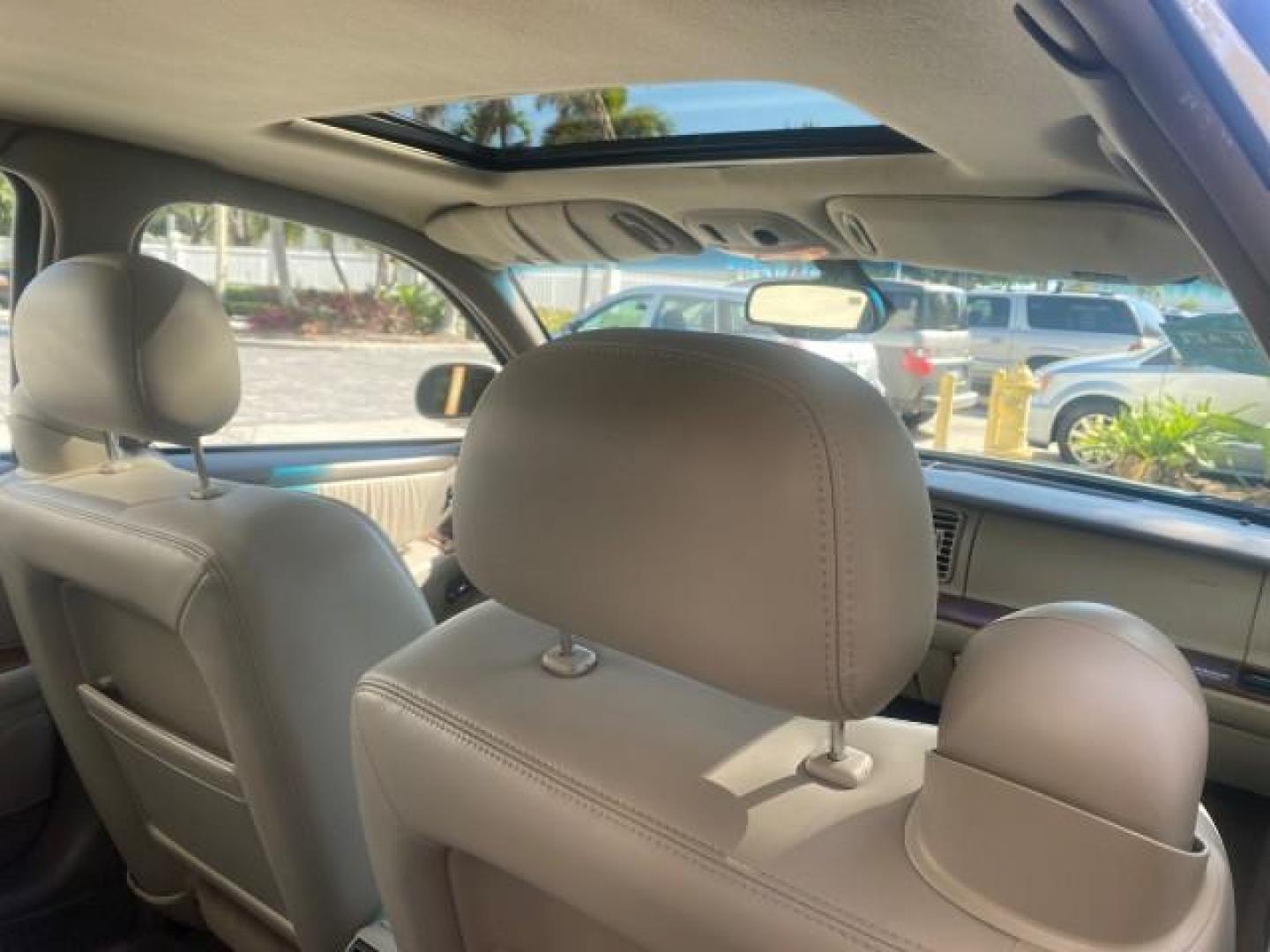 2001 White /Shale Buick Park Avenue LOW MILES 40,143 SUNROOF PEARL (1G4CW54K114) with an 3.8L SFI V6 3800 Series II Engine engine, Automatic transmission, located at 4701 North Dixie Hwy, Pompano Beach, FL, 33064, (954) 422-2889, 26.240938, -80.123474 - OUR WEBPAGE FLORIDACARS1.COM HAS OVER 100 PHOTOS AND FREE CARFAX LINK 2001 BUICK PARK AVENUE HARD TO FIND ! VIN: 1G4CW54K114283664 1 G 4 C W 5 4 K 1 1 4 2 8 3 6 6 4 SEDAN 4 DR 3.8L V6 F 12V GASOLINE 30 MPG FRONT WHEEL DRIVE Top Features Alloy Wheels Leather Seats Basic Features ABS Brakes Automatic - Photo#90