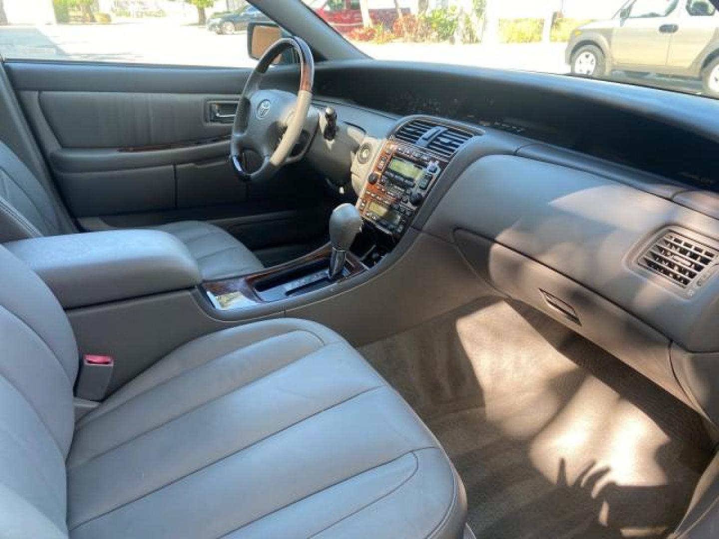 2004 Phantom Gray Pearl /Stone Toyota Avalon XLS LEATHER LOW MILES 60,653 4 BRAND NEW TIRES (4T1BF28B74U) with an 3.0L DOHC MPFI 24-Valve V6 Engine engine, Automatic transmission, located at 4701 North Dixie Hwy, Pompano Beach, FL, 33064, (954) 422-2889, 26.240938, -80.123474 - OUR WEBPAGE FLORIDACARS1.COM HAS OVER 100 PHOTOS AND FREE CARFAX LINK 2004 TOYOTA AVALON XLS NO RECALLS VIN: 4T1BF28B74U353130 4 T 1 B F 2 8 B 7 4 U 3 5 3 1 3 0 SEDAN 4 DR 3.0L V6 F DOHC 24V 29 MPG GASOLINE FRONT WHEEL DRIVE SUNROOF Top Features Alloy Wheels Luxury Package Front Seat Heaters Memory - Photo#95