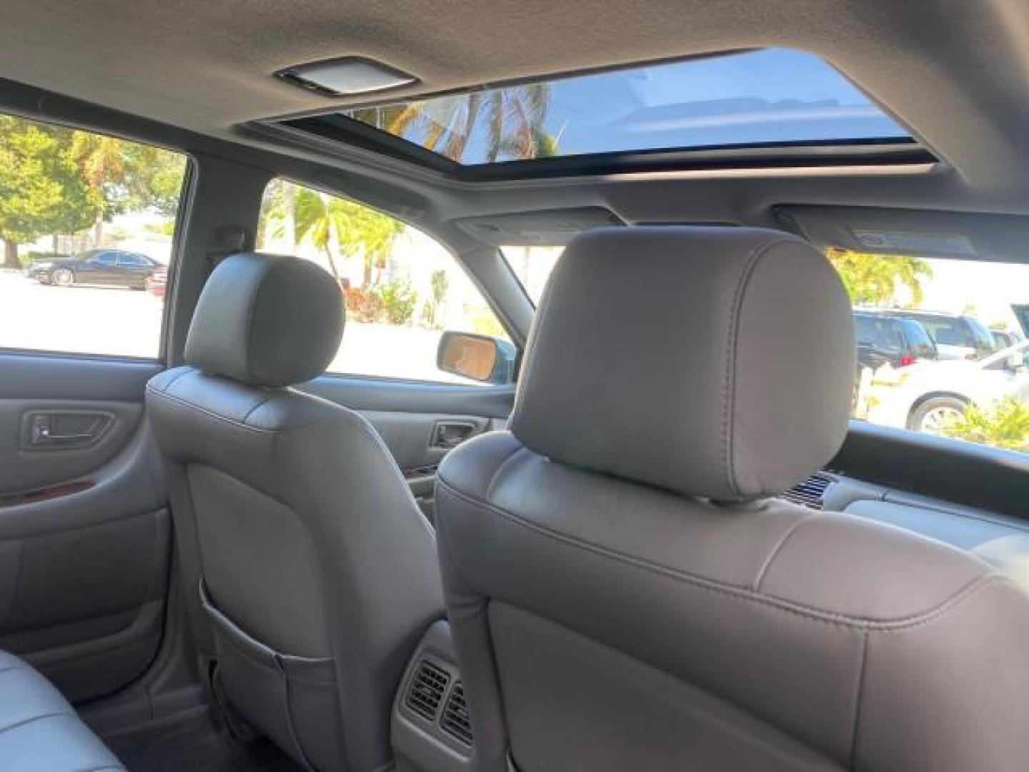 2004 Phantom Gray Pearl /Stone Toyota Avalon XLS LEATHER LOW MILES 60,653 4 BRAND NEW TIRES (4T1BF28B74U) with an 3.0L DOHC MPFI 24-Valve V6 Engine engine, Automatic transmission, located at 4701 North Dixie Hwy, Pompano Beach, FL, 33064, (954) 422-2889, 26.240938, -80.123474 - OUR WEBPAGE FLORIDACARS1.COM HAS OVER 100 PHOTOS AND FREE CARFAX LINK 2004 TOYOTA AVALON XLS NO RECALLS VIN: 4T1BF28B74U353130 4 T 1 B F 2 8 B 7 4 U 3 5 3 1 3 0 SEDAN 4 DR 3.0L V6 F DOHC 24V 29 MPG GASOLINE FRONT WHEEL DRIVE SUNROOF Top Features Alloy Wheels Luxury Package Front Seat Heaters Memory - Photo#88