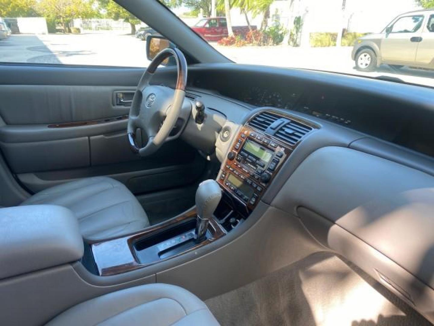 2004 Phantom Gray Pearl /Stone Toyota Avalon XLS LEATHER LOW MILES 60,653 4 BRAND NEW TIRES (4T1BF28B74U) with an 3.0L DOHC MPFI 24-Valve V6 Engine engine, Automatic transmission, located at 4701 North Dixie Hwy, Pompano Beach, FL, 33064, (954) 422-2889, 26.240938, -80.123474 - OUR WEBPAGE FLORIDACARS1.COM HAS OVER 100 PHOTOS AND FREE CARFAX LINK 2004 TOYOTA AVALON XLS NO RECALLS VIN: 4T1BF28B74U353130 4 T 1 B F 2 8 B 7 4 U 3 5 3 1 3 0 SEDAN 4 DR 3.0L V6 F DOHC 24V 29 MPG GASOLINE FRONT WHEEL DRIVE SUNROOF Top Features Alloy Wheels Luxury Package Front Seat Heaters Memory - Photo#97
