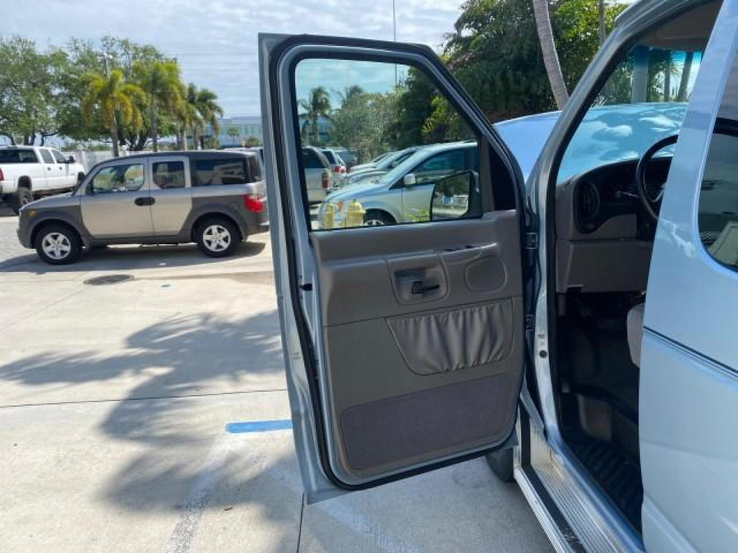 1999 Light Blue /Medium Parchment Ford Econoline Wagon XLT 15 PAS VAN EXT (1FBSS31S6XH) with an 6.8L EFI V10 Engine engine, Automatic transmission, located at 4701 North Dixie Hwy, Pompano Beach, FL, 33064, (954) 422-2889, 26.240938, -80.123474 - OUR WEBPAGE FLORIDACARS1.COM HAS OVER 100 PHOTOS AND FREE CARFAX LINK 1999 1999 FORD E-350 XL XLT SD 15 PASSENGER VIN: 1FBSS31S6XHB80914 VAN 6.8L V10 F SOHC 20V GASOLINE REAR WHEEL DRIVE Top Features Cloth Seats Basic Features ABS Brakes Air Conditioning Cassette Player Power Locks AM/FM Stereo Auto - Photo#9