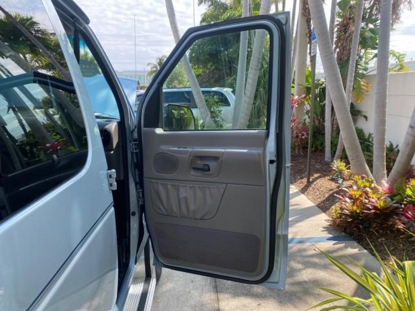 1999 Light Blue /Medium Parchment Ford Econoline Wagon XLT 15 PAS VAN EXT (1FBSS31S6XH) with an 6.8L EFI V10 Engine engine, Automatic transmission, located at 4701 North Dixie Hwy, Pompano Beach, FL, 33064, (954) 422-2889, 26.240938, -80.123474 - OUR WEBPAGE FLORIDACARS1.COM HAS OVER 100 PHOTOS AND FREE CARFAX LINK 1999 1999 FORD E-350 XL XLT SD 15 PASSENGER VIN: 1FBSS31S6XHB80914 VAN 6.8L V10 F SOHC 20V GASOLINE REAR WHEEL DRIVE Top Features Cloth Seats Basic Features ABS Brakes Air Conditioning Cassette Player Power Locks AM/FM Stereo Auto - Photo#11