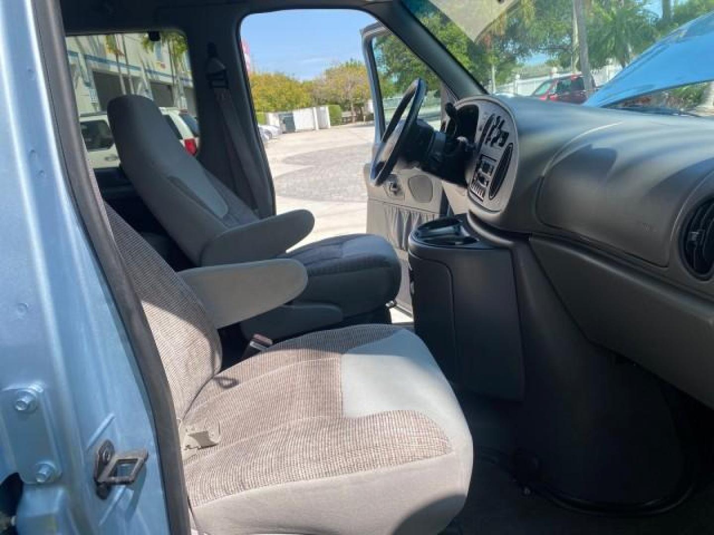 1999 Light Blue /Medium Parchment Ford Econoline Wagon XLT 15 PAS VAN EXT (1FBSS31S6XH) with an 6.8L EFI V10 Engine engine, Automatic transmission, located at 4701 North Dixie Hwy, Pompano Beach, FL, 33064, (954) 422-2889, 26.240938, -80.123474 - OUR WEBPAGE FLORIDACARS1.COM HAS OVER 100 PHOTOS AND FREE CARFAX LINK 1999 1999 FORD E-350 XL XLT SD 15 PASSENGER VIN: 1FBSS31S6XHB80914 VAN 6.8L V10 F SOHC 20V GASOLINE REAR WHEEL DRIVE Top Features Cloth Seats Basic Features ABS Brakes Air Conditioning Cassette Player Power Locks AM/FM Stereo Auto - Photo#12