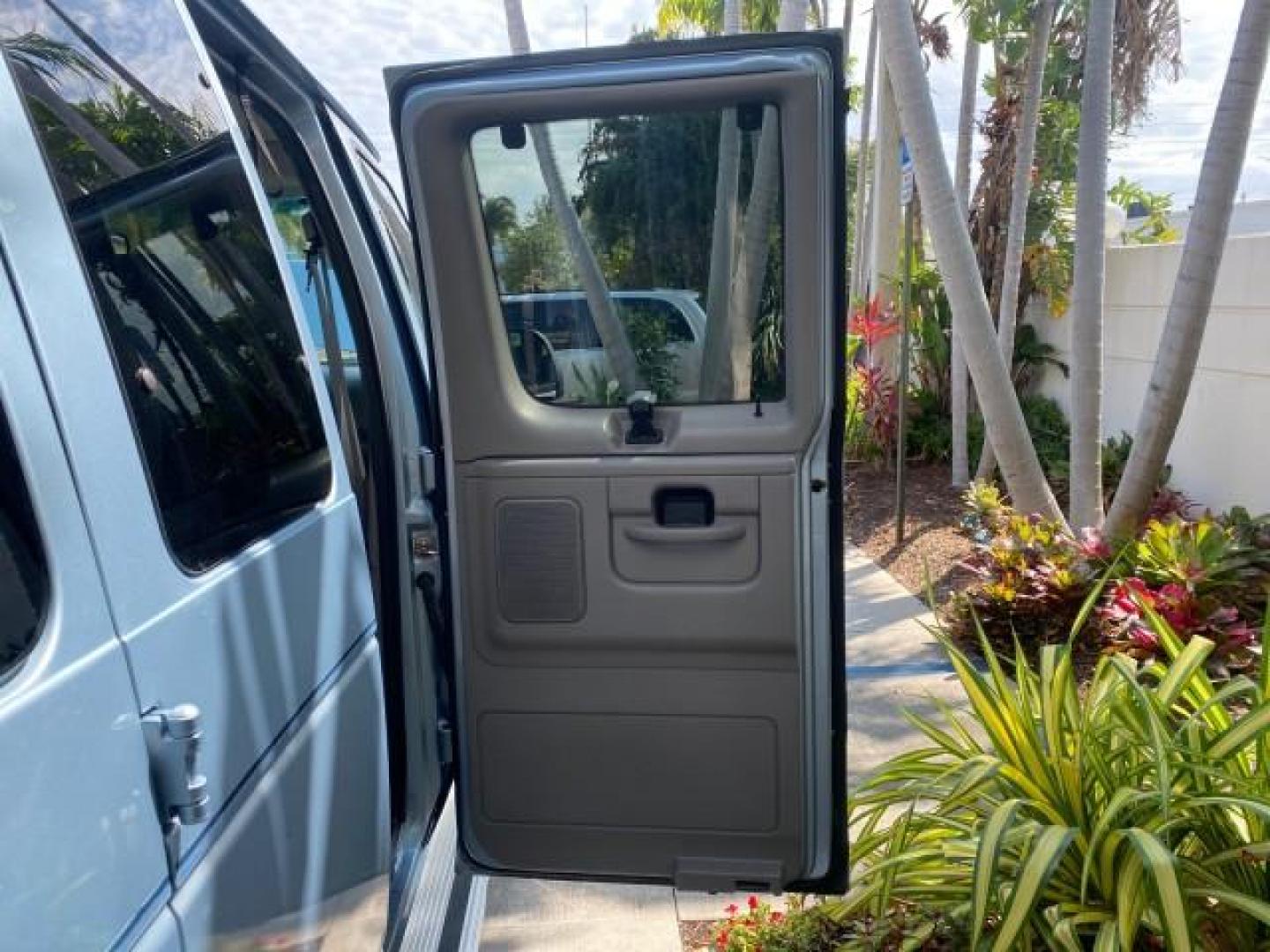 1999 Light Blue /Medium Parchment Ford Econoline Wagon XLT 15 PAS VAN EXT (1FBSS31S6XH) with an 6.8L EFI V10 Engine engine, Automatic transmission, located at 4701 North Dixie Hwy, Pompano Beach, FL, 33064, (954) 422-2889, 26.240938, -80.123474 - OUR WEBPAGE FLORIDACARS1.COM HAS OVER 100 PHOTOS AND FREE CARFAX LINK 1999 1999 FORD E-350 XL XLT SD 15 PASSENGER VIN: 1FBSS31S6XHB80914 VAN 6.8L V10 F SOHC 20V GASOLINE REAR WHEEL DRIVE Top Features Cloth Seats Basic Features ABS Brakes Air Conditioning Cassette Player Power Locks AM/FM Stereo Auto - Photo#13