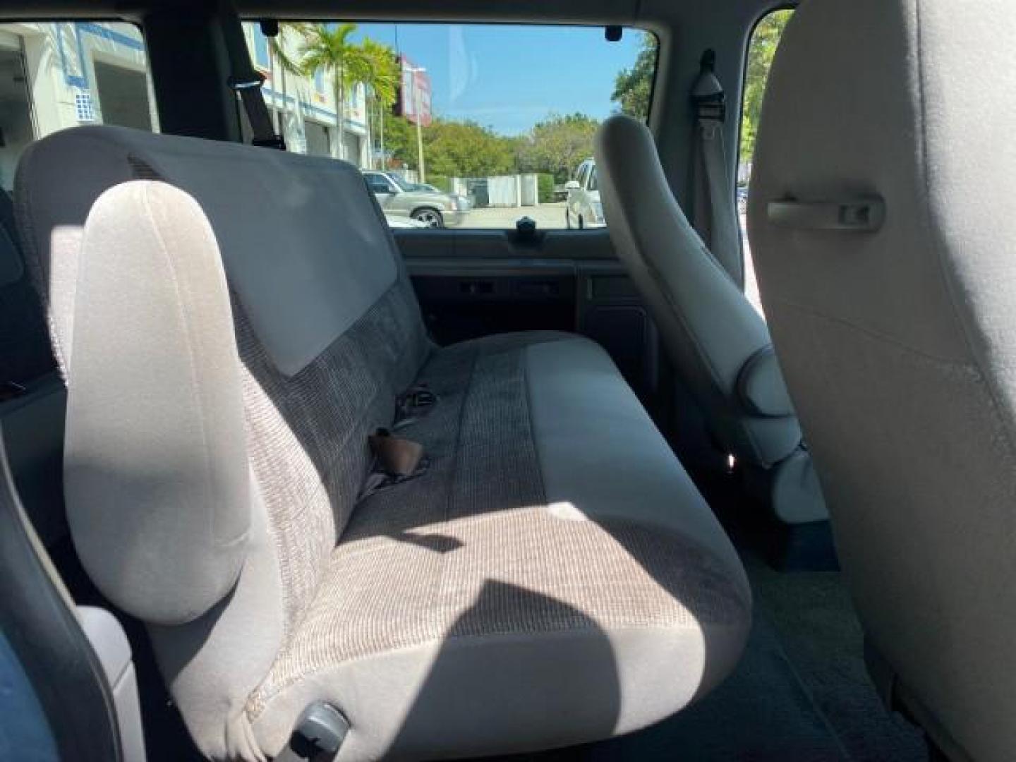 1999 Light Blue /Medium Parchment Ford Econoline Wagon XLT 15 PAS VAN EXT (1FBSS31S6XH) with an 6.8L EFI V10 Engine engine, Automatic transmission, located at 4701 North Dixie Hwy, Pompano Beach, FL, 33064, (954) 422-2889, 26.240938, -80.123474 - OUR WEBPAGE FLORIDACARS1.COM HAS OVER 100 PHOTOS AND FREE CARFAX LINK 1999 1999 FORD E-350 XL XLT SD 15 PASSENGER VIN: 1FBSS31S6XHB80914 VAN 6.8L V10 F SOHC 20V GASOLINE REAR WHEEL DRIVE Top Features Cloth Seats Basic Features ABS Brakes Air Conditioning Cassette Player Power Locks AM/FM Stereo Auto - Photo#14