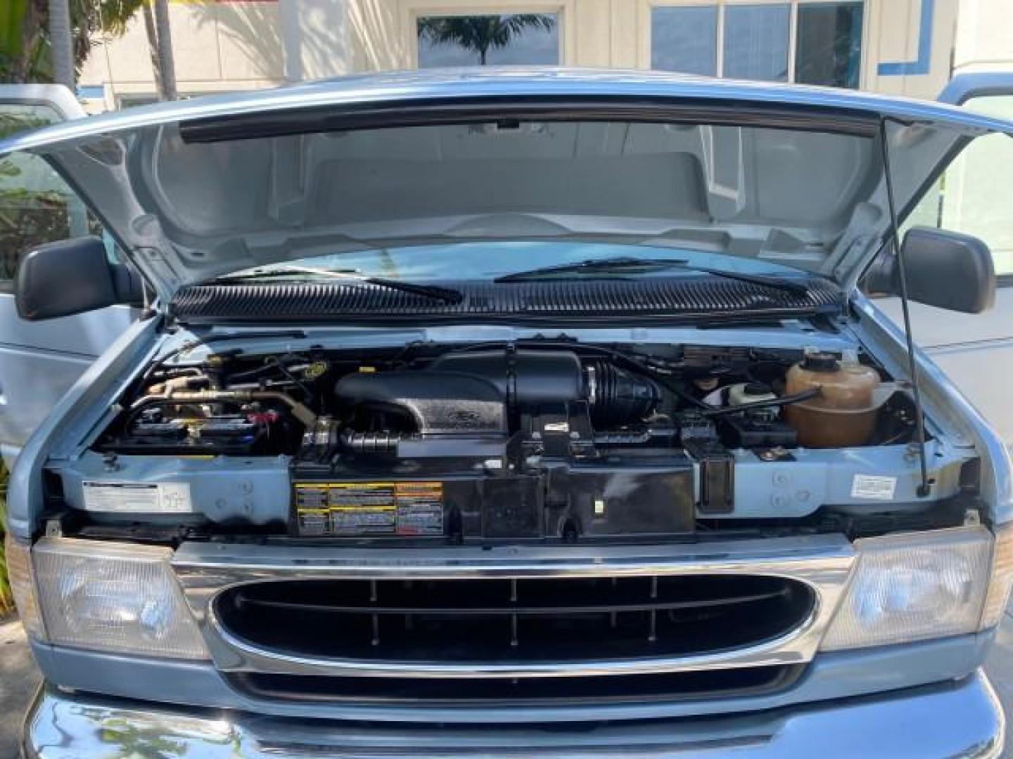 1999 Light Blue /Medium Parchment Ford Econoline Wagon XLT 15 PAS VAN EXT (1FBSS31S6XH) with an 6.8L EFI V10 Engine engine, Automatic transmission, located at 4701 North Dixie Hwy, Pompano Beach, FL, 33064, (954) 422-2889, 26.240938, -80.123474 - OUR WEBPAGE FLORIDACARS1.COM HAS OVER 100 PHOTOS AND FREE CARFAX LINK 1999 1999 FORD E-350 XL XLT SD 15 PASSENGER VIN: 1FBSS31S6XHB80914 VAN 6.8L V10 F SOHC 20V GASOLINE REAR WHEEL DRIVE Top Features Cloth Seats Basic Features ABS Brakes Air Conditioning Cassette Player Power Locks AM/FM Stereo Auto - Photo#17