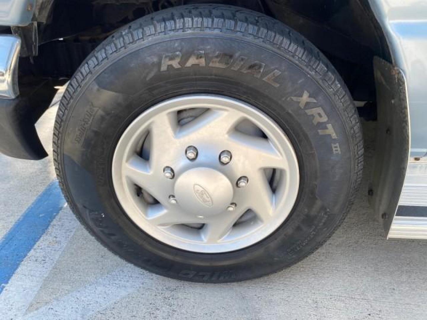 1999 Light Blue /Medium Parchment Ford Econoline Wagon XLT 15 PAS VAN EXT (1FBSS31S6XH) with an 6.8L EFI V10 Engine engine, Automatic transmission, located at 4701 North Dixie Hwy, Pompano Beach, FL, 33064, (954) 422-2889, 26.240938, -80.123474 - OUR WEBPAGE FLORIDACARS1.COM HAS OVER 100 PHOTOS AND FREE CARFAX LINK 1999 1999 FORD E-350 XL XLT SD 15 PASSENGER VIN: 1FBSS31S6XHB80914 VAN 6.8L V10 F SOHC 20V GASOLINE REAR WHEEL DRIVE Top Features Cloth Seats Basic Features ABS Brakes Air Conditioning Cassette Player Power Locks AM/FM Stereo Auto - Photo#19