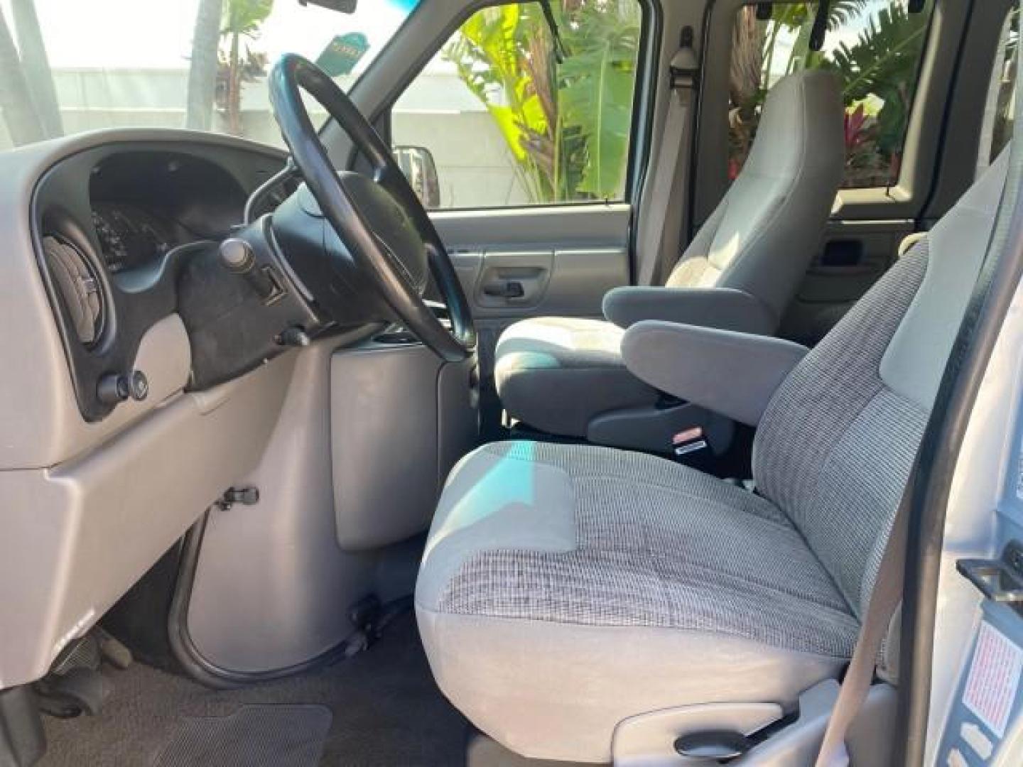 1999 Light Blue /Medium Parchment Ford Econoline Wagon XLT 15 PAS VAN EXT (1FBSS31S6XH) with an 6.8L EFI V10 Engine engine, Automatic transmission, located at 4701 North Dixie Hwy, Pompano Beach, FL, 33064, (954) 422-2889, 26.240938, -80.123474 - OUR WEBPAGE FLORIDACARS1.COM HAS OVER 100 PHOTOS AND FREE CARFAX LINK 1999 1999 FORD E-350 XL XLT SD 15 PASSENGER VIN: 1FBSS31S6XHB80914 VAN 6.8L V10 F SOHC 20V GASOLINE REAR WHEEL DRIVE Top Features Cloth Seats Basic Features ABS Brakes Air Conditioning Cassette Player Power Locks AM/FM Stereo Auto - Photo#30