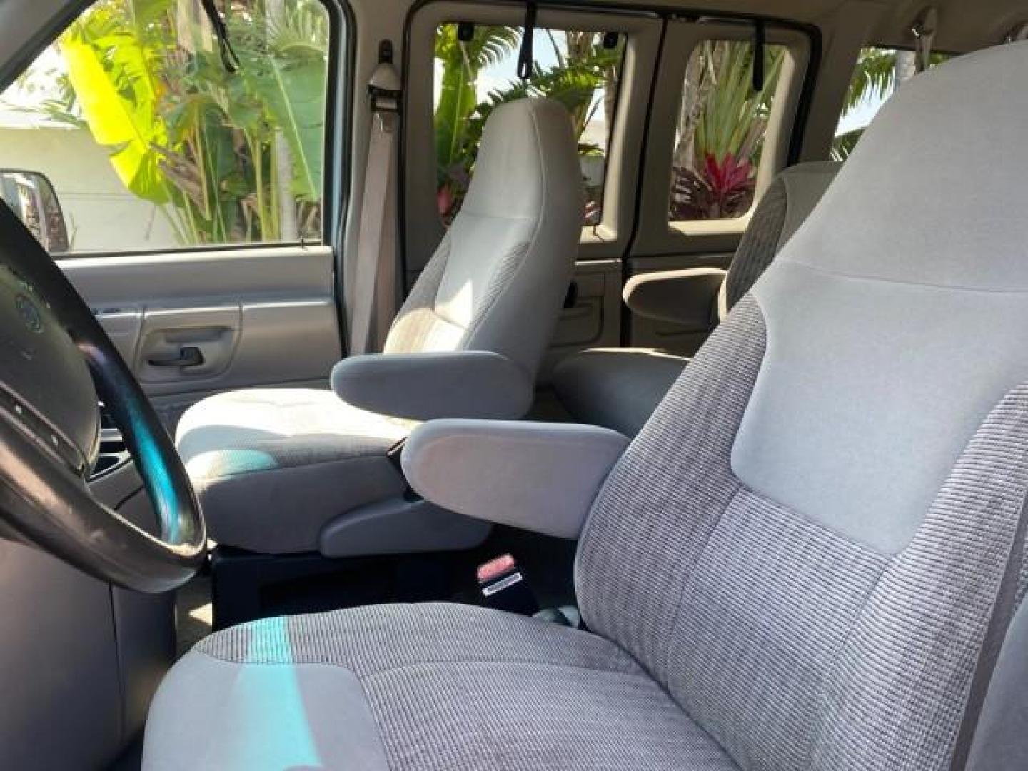 1999 Light Blue /Medium Parchment Ford Econoline Wagon XLT 15 PAS VAN EXT (1FBSS31S6XH) with an 6.8L EFI V10 Engine engine, Automatic transmission, located at 4701 North Dixie Hwy, Pompano Beach, FL, 33064, (954) 422-2889, 26.240938, -80.123474 - OUR WEBPAGE FLORIDACARS1.COM HAS OVER 100 PHOTOS AND FREE CARFAX LINK 1999 1999 FORD E-350 XL XLT SD 15 PASSENGER VIN: 1FBSS31S6XHB80914 VAN 6.8L V10 F SOHC 20V GASOLINE REAR WHEEL DRIVE Top Features Cloth Seats Basic Features ABS Brakes Air Conditioning Cassette Player Power Locks AM/FM Stereo Auto - Photo#31