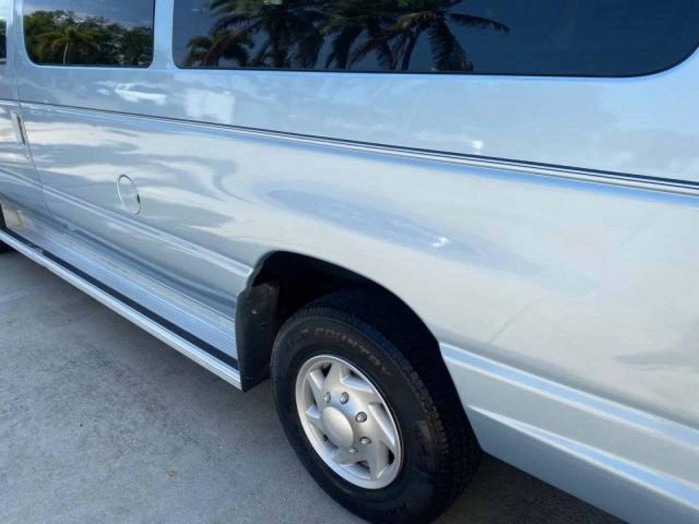 1999 Light Blue /Medium Parchment Ford Econoline Wagon XLT 15 PAS VAN EXT (1FBSS31S6XH) with an 6.8L EFI V10 Engine engine, Automatic transmission, located at 4701 North Dixie Hwy, Pompano Beach, FL, 33064, (954) 422-2889, 26.240938, -80.123474 - OUR WEBPAGE FLORIDACARS1.COM HAS OVER 100 PHOTOS AND FREE CARFAX LINK 1999 1999 FORD E-350 XL XLT SD 15 PASSENGER VIN: 1FBSS31S6XHB80914 VAN 6.8L V10 F SOHC 20V GASOLINE REAR WHEEL DRIVE Top Features Cloth Seats Basic Features ABS Brakes Air Conditioning Cassette Player Power Locks AM/FM Stereo Auto - Photo#62