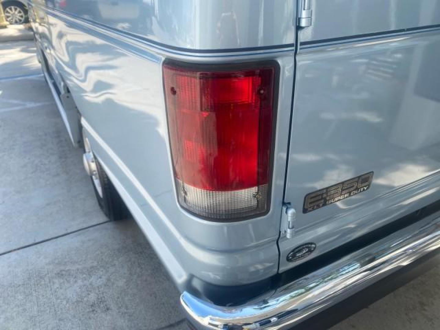 1999 Light Blue /Medium Parchment Ford Econoline Wagon XLT 15 PAS VAN EXT (1FBSS31S6XH) with an 6.8L EFI V10 Engine engine, Automatic transmission, located at 4701 North Dixie Hwy, Pompano Beach, FL, 33064, (954) 422-2889, 26.240938, -80.123474 - OUR WEBPAGE FLORIDACARS1.COM HAS OVER 100 PHOTOS AND FREE CARFAX LINK 1999 1999 FORD E-350 XL XLT SD 15 PASSENGER VIN: 1FBSS31S6XHB80914 VAN 6.8L V10 F SOHC 20V GASOLINE REAR WHEEL DRIVE Top Features Cloth Seats Basic Features ABS Brakes Air Conditioning Cassette Player Power Locks AM/FM Stereo Auto - Photo#66