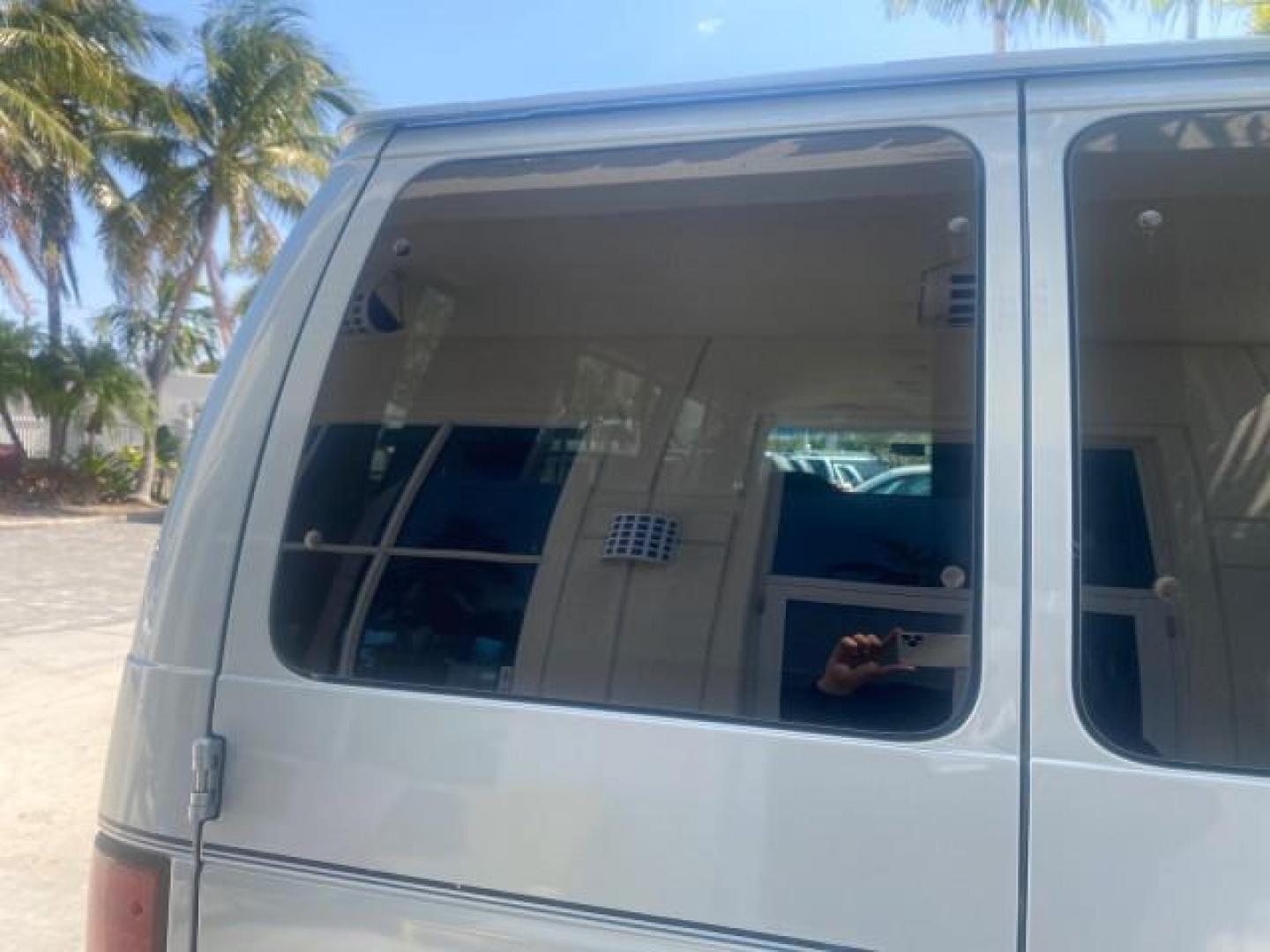 1999 Light Blue /Medium Parchment Ford Econoline Wagon XLT 15 PAS VAN EXT (1FBSS31S6XH) with an 6.8L EFI V10 Engine engine, Automatic transmission, located at 4701 North Dixie Hwy, Pompano Beach, FL, 33064, (954) 422-2889, 26.240938, -80.123474 - OUR WEBPAGE FLORIDACARS1.COM HAS OVER 100 PHOTOS AND FREE CARFAX LINK 1999 1999 FORD E-350 XL XLT SD 15 PASSENGER VIN: 1FBSS31S6XHB80914 VAN 6.8L V10 F SOHC 20V GASOLINE REAR WHEEL DRIVE Top Features Cloth Seats Basic Features ABS Brakes Air Conditioning Cassette Player Power Locks AM/FM Stereo Auto - Photo#69