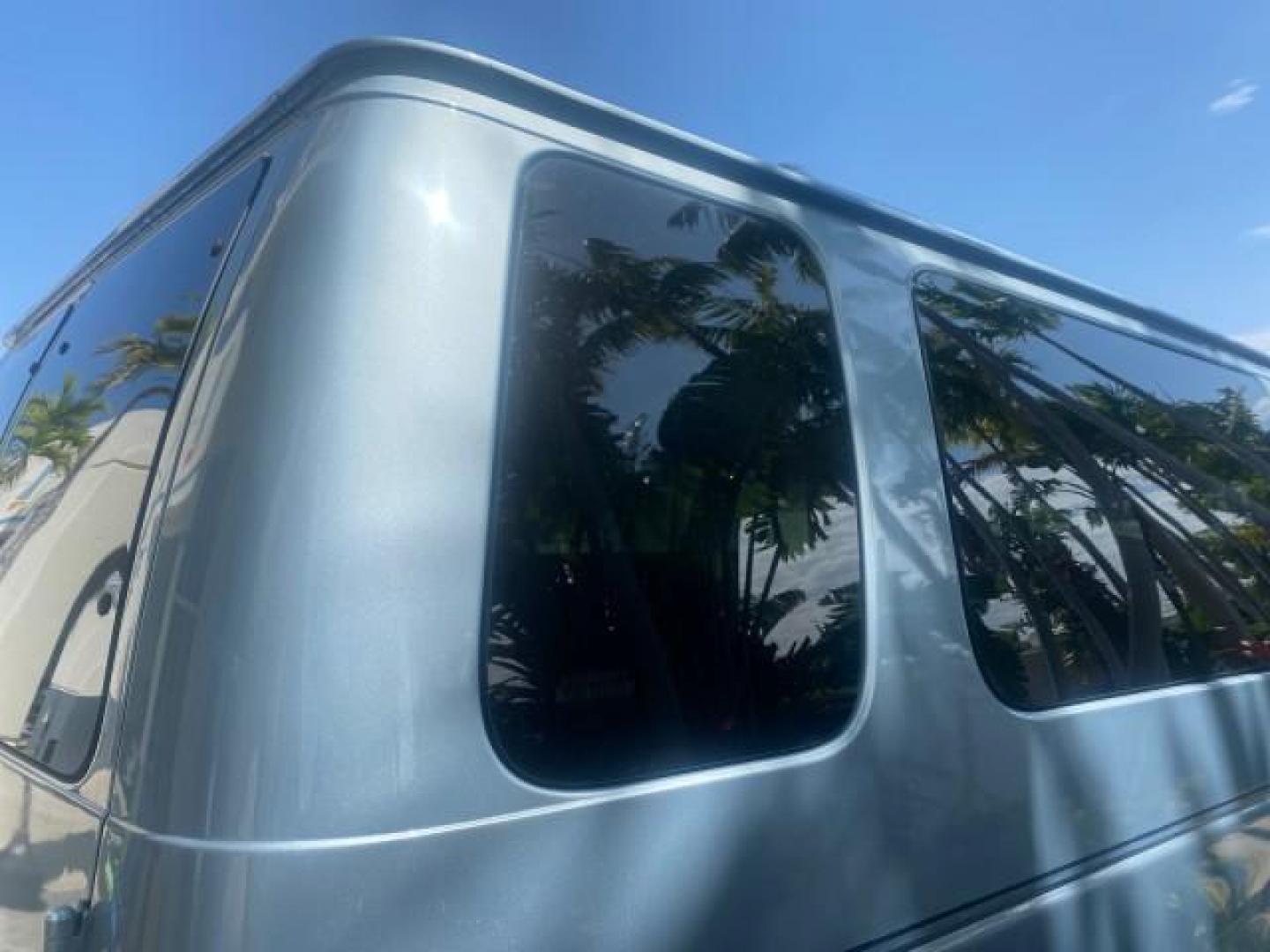 1999 Light Blue /Medium Parchment Ford Econoline Wagon XLT 15 PAS VAN EXT (1FBSS31S6XH) with an 6.8L EFI V10 Engine engine, Automatic transmission, located at 4701 North Dixie Hwy, Pompano Beach, FL, 33064, (954) 422-2889, 26.240938, -80.123474 - OUR WEBPAGE FLORIDACARS1.COM HAS OVER 100 PHOTOS AND FREE CARFAX LINK 1999 1999 FORD E-350 XL XLT SD 15 PASSENGER VIN: 1FBSS31S6XHB80914 VAN 6.8L V10 F SOHC 20V GASOLINE REAR WHEEL DRIVE Top Features Cloth Seats Basic Features ABS Brakes Air Conditioning Cassette Player Power Locks AM/FM Stereo Auto - Photo#76