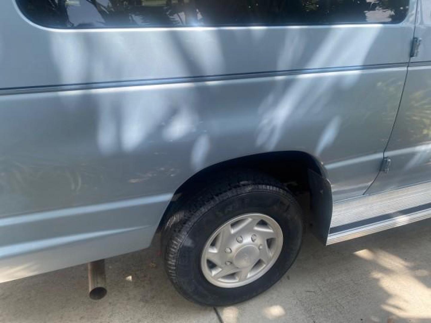1999 Light Blue /Medium Parchment Ford Econoline Wagon XLT 15 PAS VAN EXT (1FBSS31S6XH) with an 6.8L EFI V10 Engine engine, Automatic transmission, located at 4701 North Dixie Hwy, Pompano Beach, FL, 33064, (954) 422-2889, 26.240938, -80.123474 - OUR WEBPAGE FLORIDACARS1.COM HAS OVER 100 PHOTOS AND FREE CARFAX LINK 1999 1999 FORD E-350 XL XLT SD 15 PASSENGER VIN: 1FBSS31S6XHB80914 VAN 6.8L V10 F SOHC 20V GASOLINE REAR WHEEL DRIVE Top Features Cloth Seats Basic Features ABS Brakes Air Conditioning Cassette Player Power Locks AM/FM Stereo Auto - Photo#78