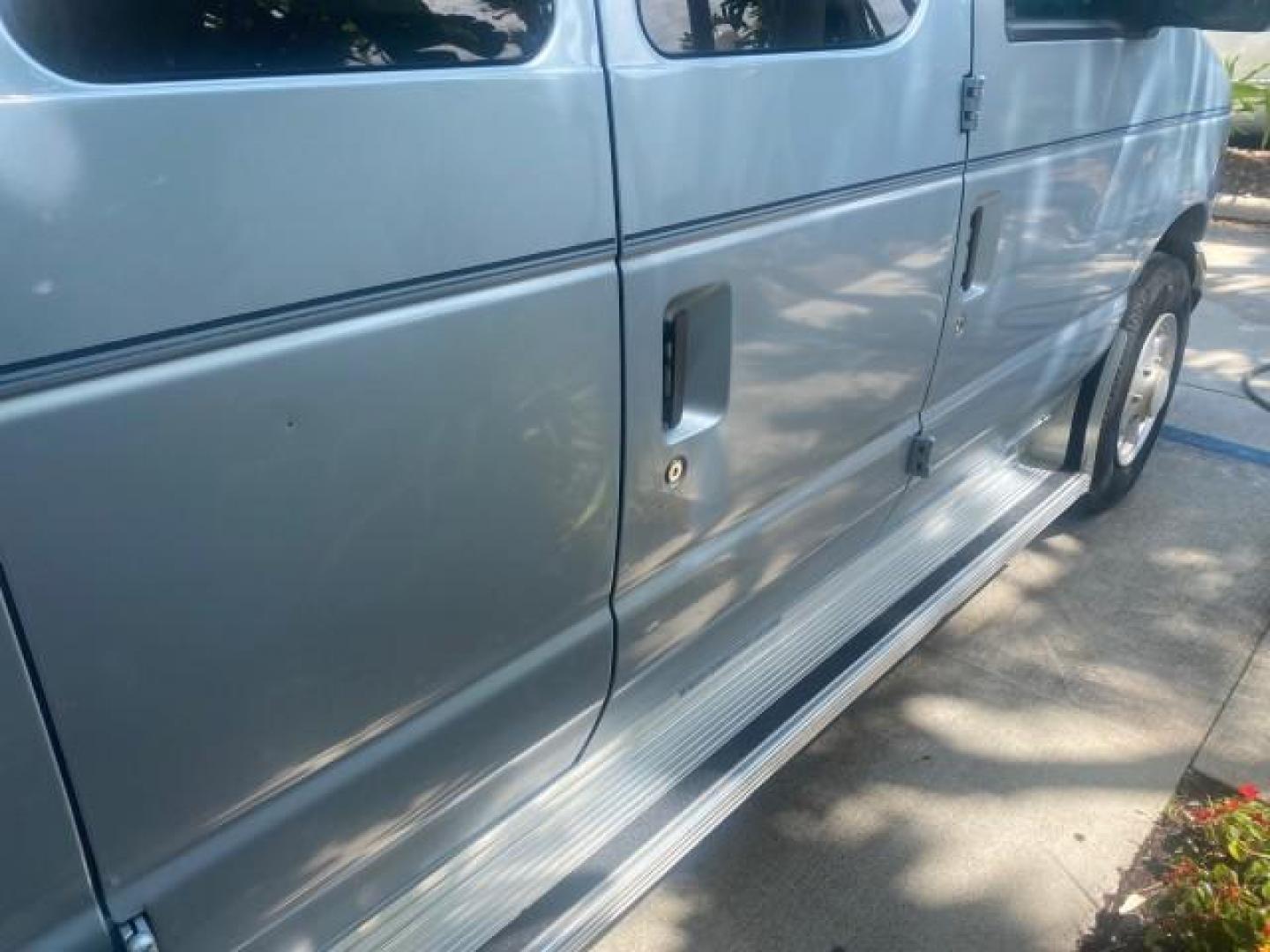 1999 Light Blue /Medium Parchment Ford Econoline Wagon XLT 15 PAS VAN EXT (1FBSS31S6XH) with an 6.8L EFI V10 Engine engine, Automatic transmission, located at 4701 North Dixie Hwy, Pompano Beach, FL, 33064, (954) 422-2889, 26.240938, -80.123474 - OUR WEBPAGE FLORIDACARS1.COM HAS OVER 100 PHOTOS AND FREE CARFAX LINK 1999 1999 FORD E-350 XL XLT SD 15 PASSENGER VIN: 1FBSS31S6XHB80914 VAN 6.8L V10 F SOHC 20V GASOLINE REAR WHEEL DRIVE Top Features Cloth Seats Basic Features ABS Brakes Air Conditioning Cassette Player Power Locks AM/FM Stereo Auto - Photo#82