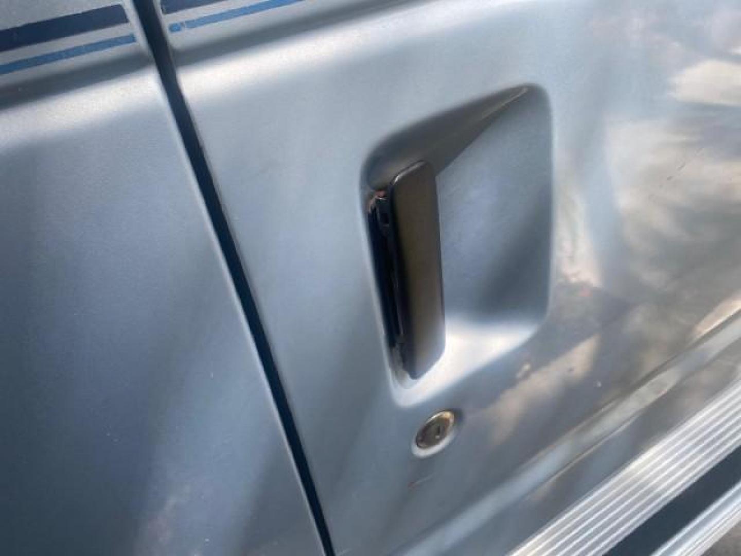 1999 Light Blue /Medium Parchment Ford Econoline Wagon XLT 15 PAS VAN EXT (1FBSS31S6XH) with an 6.8L EFI V10 Engine engine, Automatic transmission, located at 4701 North Dixie Hwy, Pompano Beach, FL, 33064, (954) 422-2889, 26.240938, -80.123474 - OUR WEBPAGE FLORIDACARS1.COM HAS OVER 100 PHOTOS AND FREE CARFAX LINK 1999 1999 FORD E-350 XL XLT SD 15 PASSENGER VIN: 1FBSS31S6XHB80914 VAN 6.8L V10 F SOHC 20V GASOLINE REAR WHEEL DRIVE Top Features Cloth Seats Basic Features ABS Brakes Air Conditioning Cassette Player Power Locks AM/FM Stereo Auto - Photo#83