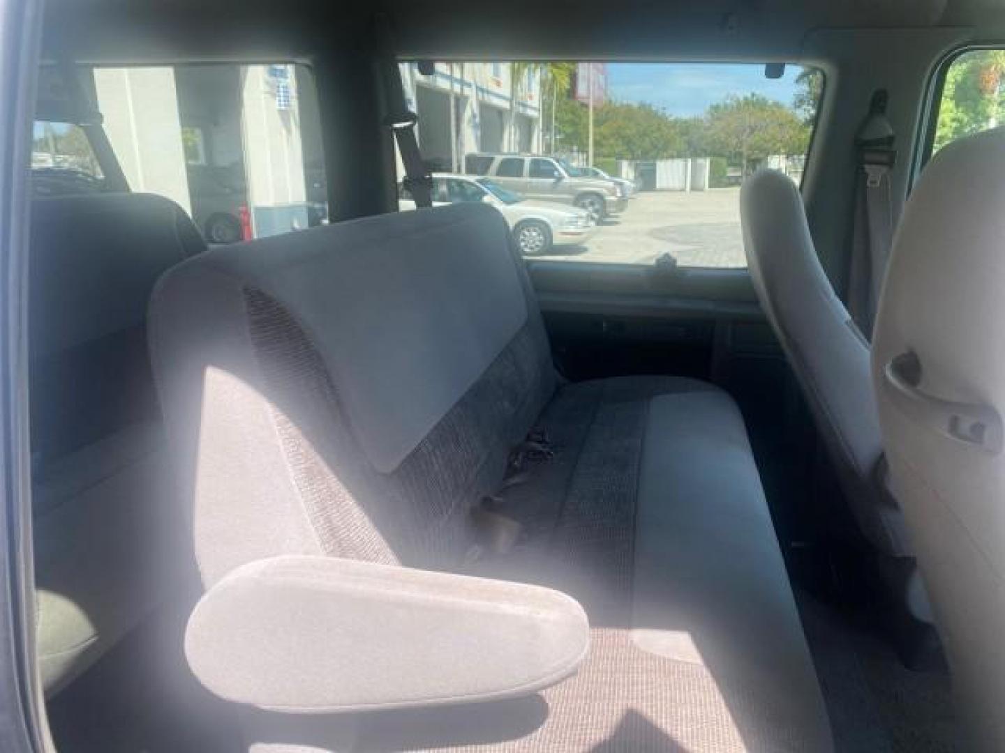 1999 Light Blue /Medium Parchment Ford Econoline Wagon XLT 15 PAS VAN EXT (1FBSS31S6XH) with an 6.8L EFI V10 Engine engine, Automatic transmission, located at 4701 North Dixie Hwy, Pompano Beach, FL, 33064, (954) 422-2889, 26.240938, -80.123474 - OUR WEBPAGE FLORIDACARS1.COM HAS OVER 100 PHOTOS AND FREE CARFAX LINK 1999 1999 FORD E-350 XL XLT SD 15 PASSENGER VIN: 1FBSS31S6XHB80914 VAN 6.8L V10 F SOHC 20V GASOLINE REAR WHEEL DRIVE Top Features Cloth Seats Basic Features ABS Brakes Air Conditioning Cassette Player Power Locks AM/FM Stereo Auto - Photo#87