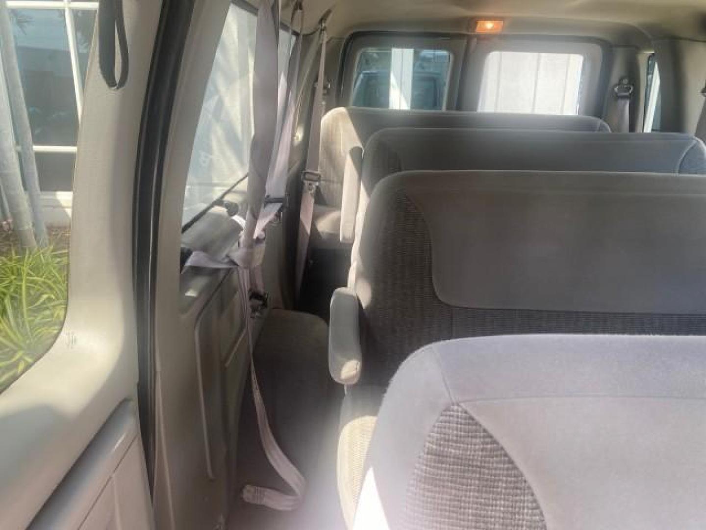 1999 Light Blue /Medium Parchment Ford Econoline Wagon XLT 15 PAS VAN EXT (1FBSS31S6XH) with an 6.8L EFI V10 Engine engine, Automatic transmission, located at 4701 North Dixie Hwy, Pompano Beach, FL, 33064, (954) 422-2889, 26.240938, -80.123474 - OUR WEBPAGE FLORIDACARS1.COM HAS OVER 100 PHOTOS AND FREE CARFAX LINK 1999 1999 FORD E-350 XL XLT SD 15 PASSENGER VIN: 1FBSS31S6XHB80914 VAN 6.8L V10 F SOHC 20V GASOLINE REAR WHEEL DRIVE Top Features Cloth Seats Basic Features ABS Brakes Air Conditioning Cassette Player Power Locks AM/FM Stereo Auto - Photo#97