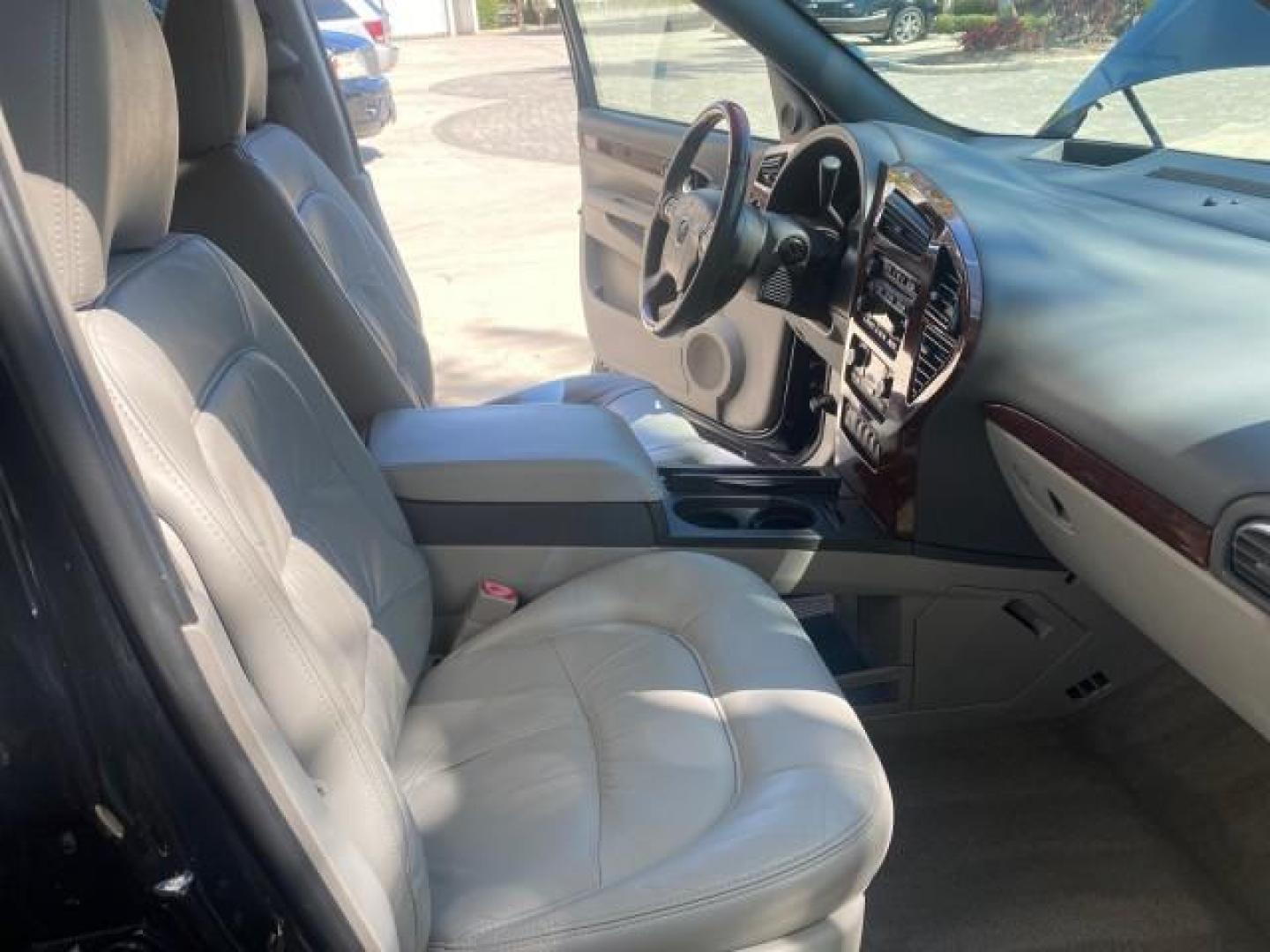 2007 Black Onyx /Gray Buick Rendezvous CXL LOW MILES 33,014 3RD ROW (3G5DA03L47S) with an 3.5L V6 SFI Engine engine, Automatic transmission, located at 4701 North Dixie Hwy, Pompano Beach, FL, 33064, (954) 422-2889, 26.240938, -80.123474 - OUR WEBPAGE FLORIDACARS1.COM HAS OVER 100 PHOTOS AND FREE CARFAX LINK 2007 BUICK RENDEZVOUS CXL NEW $32,314 VIN: 3G5DA03L47S575376 3 G 5 D A 0 3 L 4 7 S 5 7 5 3 7 6 4 DOOR WAGON/SPORT UTILITY 3.5L V6 F 17 INCH CHROME RIMS GASOLINE FRONT WHEEL DRIVE Highlighted Features Heated Seats Leather Seats AM/ - Photo#12