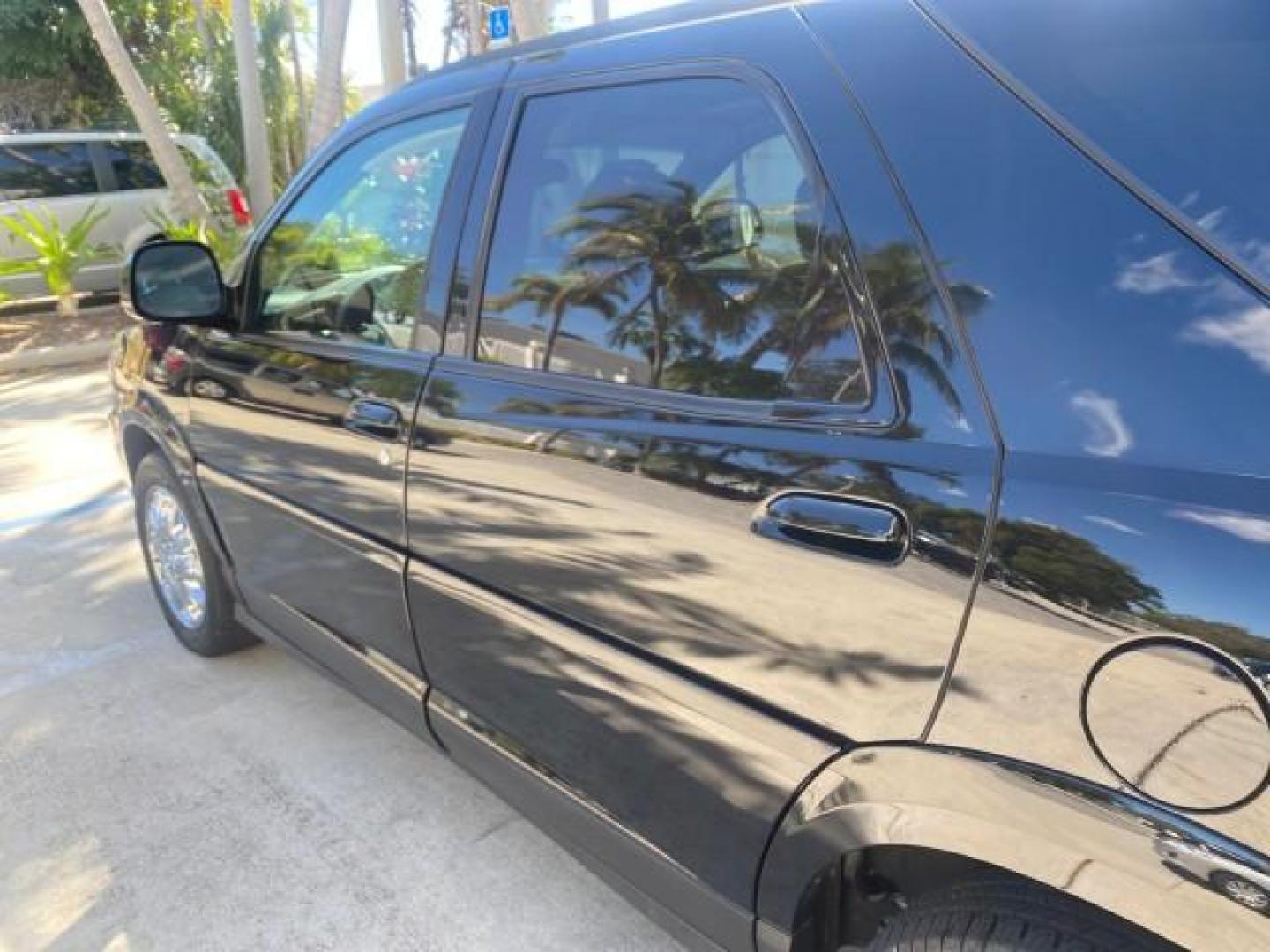 2007 Black Onyx /Gray Buick Rendezvous CXL LOW MILES 33,014 3RD ROW (3G5DA03L47S) with an 3.5L V6 SFI Engine engine, Automatic transmission, located at 4701 North Dixie Hwy, Pompano Beach, FL, 33064, (954) 422-2889, 26.240938, -80.123474 - OUR WEBPAGE FLORIDACARS1.COM HAS OVER 100 PHOTOS AND FREE CARFAX LINK 2007 BUICK RENDEZVOUS CXL NEW $32,314 VIN: 3G5DA03L47S575376 3 G 5 D A 0 3 L 4 7 S 5 7 5 3 7 6 4 DOOR WAGON/SPORT UTILITY 3.5L V6 F 17 INCH CHROME RIMS GASOLINE FRONT WHEEL DRIVE Highlighted Features Heated Seats Leather Seats AM/ - Photo#53