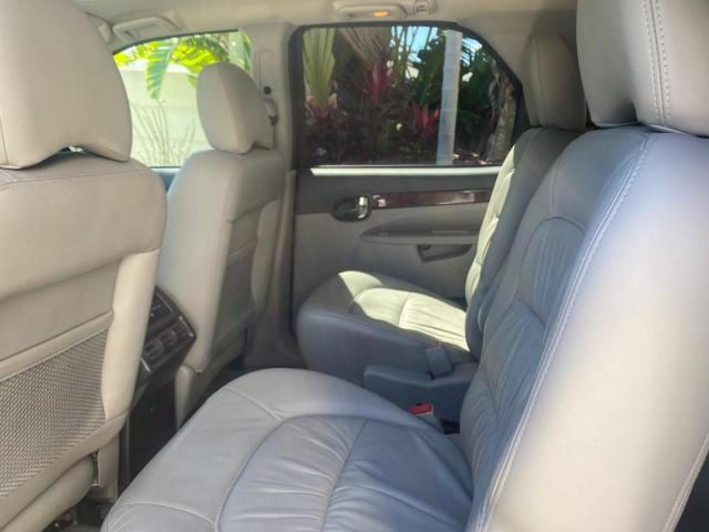 2007 Black Onyx /Gray Buick Rendezvous CXL LOW MILES 33,014 3RD ROW (3G5DA03L47S) with an 3.5L V6 SFI Engine engine, Automatic transmission, located at 4701 North Dixie Hwy, Pompano Beach, FL, 33064, (954) 422-2889, 26.240938, -80.123474 - OUR WEBPAGE FLORIDACARS1.COM HAS OVER 100 PHOTOS AND FREE CARFAX LINK 2007 BUICK RENDEZVOUS CXL NEW $32,314 VIN: 3G5DA03L47S575376 3 G 5 D A 0 3 L 4 7 S 5 7 5 3 7 6 4 DOOR WAGON/SPORT UTILITY 3.5L V6 F 17 INCH CHROME RIMS GASOLINE FRONT WHEEL DRIVE Highlighted Features Heated Seats Leather Seats AM/ - Photo#56