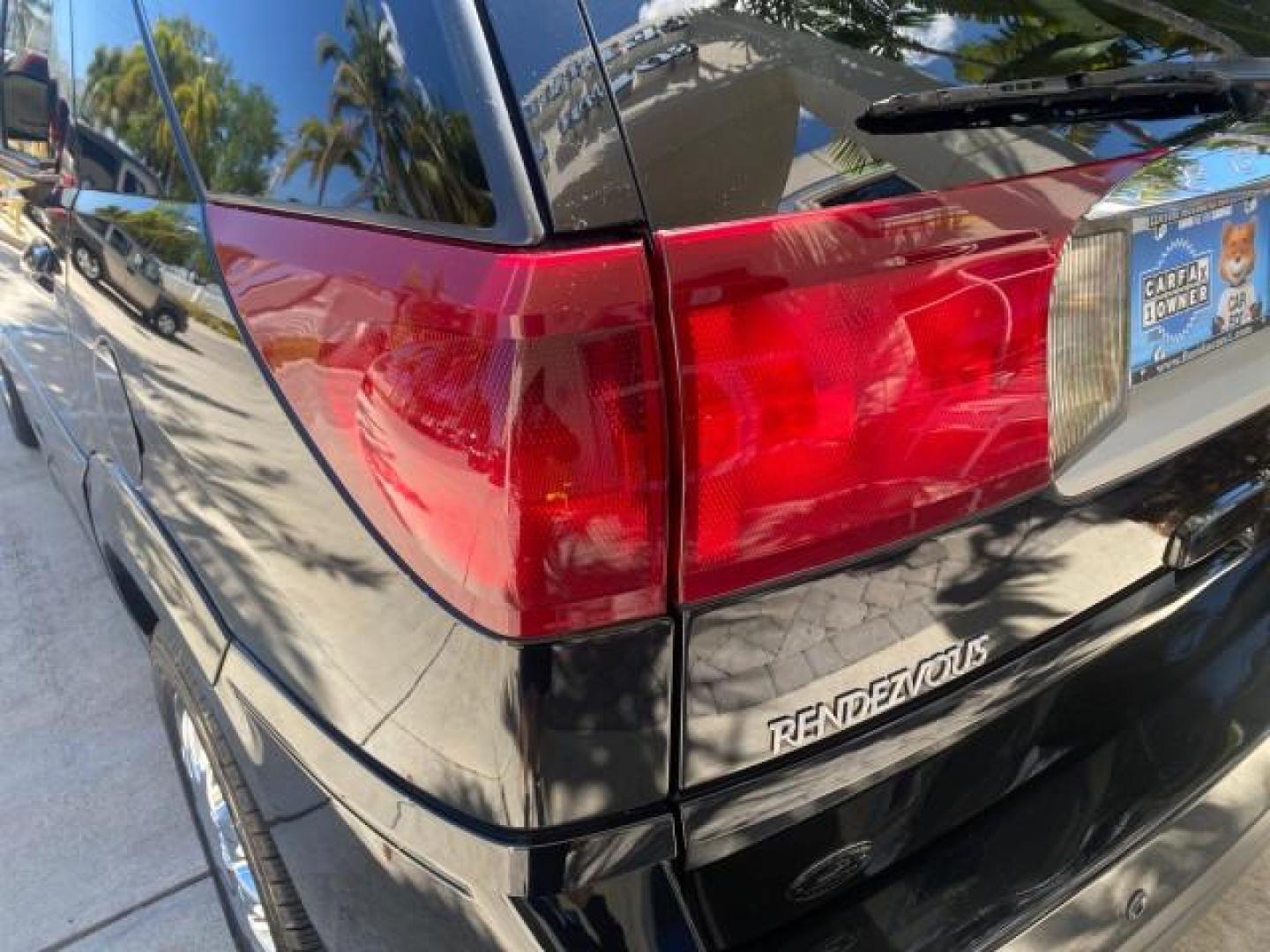 2007 Black Onyx /Gray Buick Rendezvous CXL LOW MILES 33,014 3RD ROW (3G5DA03L47S) with an 3.5L V6 SFI Engine engine, Automatic transmission, located at 4701 North Dixie Hwy, Pompano Beach, FL, 33064, (954) 422-2889, 26.240938, -80.123474 - OUR WEBPAGE FLORIDACARS1.COM HAS OVER 100 PHOTOS AND FREE CARFAX LINK 2007 BUICK RENDEZVOUS CXL NEW $32,314 VIN: 3G5DA03L47S575376 3 G 5 D A 0 3 L 4 7 S 5 7 5 3 7 6 4 DOOR WAGON/SPORT UTILITY 3.5L V6 F 17 INCH CHROME RIMS GASOLINE FRONT WHEEL DRIVE Highlighted Features Heated Seats Leather Seats AM/ - Photo#74