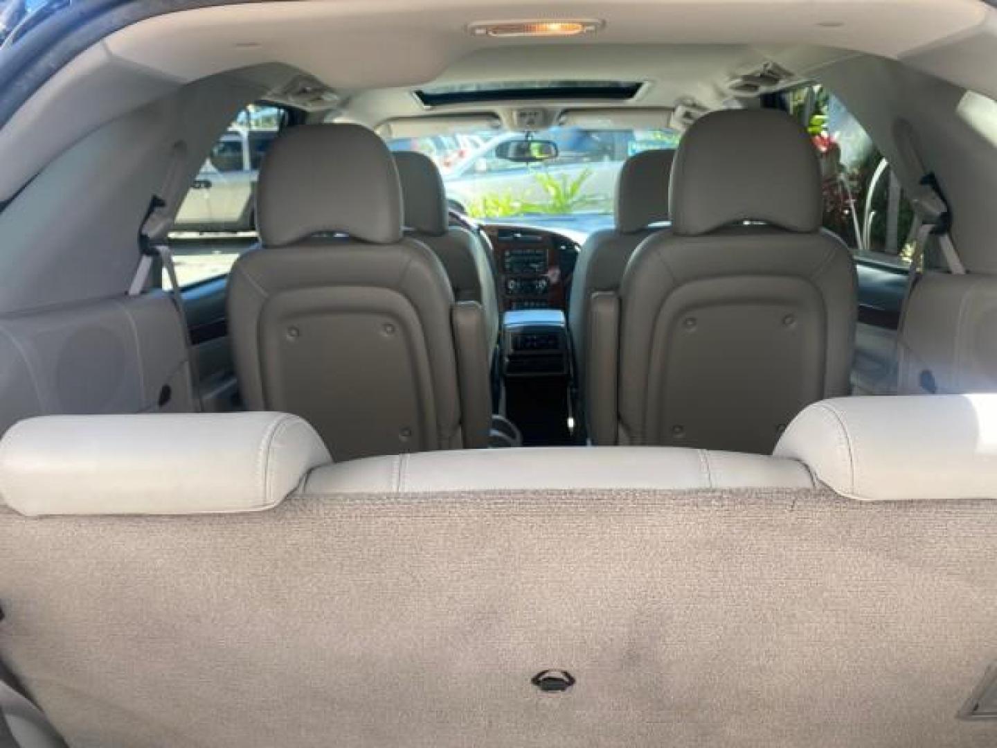 2007 Black Onyx /Gray Buick Rendezvous CXL LOW MILES 33,014 3RD ROW (3G5DA03L47S) with an 3.5L V6 SFI Engine engine, Automatic transmission, located at 4701 North Dixie Hwy, Pompano Beach, FL, 33064, (954) 422-2889, 26.240938, -80.123474 - OUR WEBPAGE FLORIDACARS1.COM HAS OVER 100 PHOTOS AND FREE CARFAX LINK 2007 BUICK RENDEZVOUS CXL NEW $32,314 VIN: 3G5DA03L47S575376 3 G 5 D A 0 3 L 4 7 S 5 7 5 3 7 6 4 DOOR WAGON/SPORT UTILITY 3.5L V6 F 17 INCH CHROME RIMS GASOLINE FRONT WHEEL DRIVE Highlighted Features Heated Seats Leather Seats AM/ - Photo#78