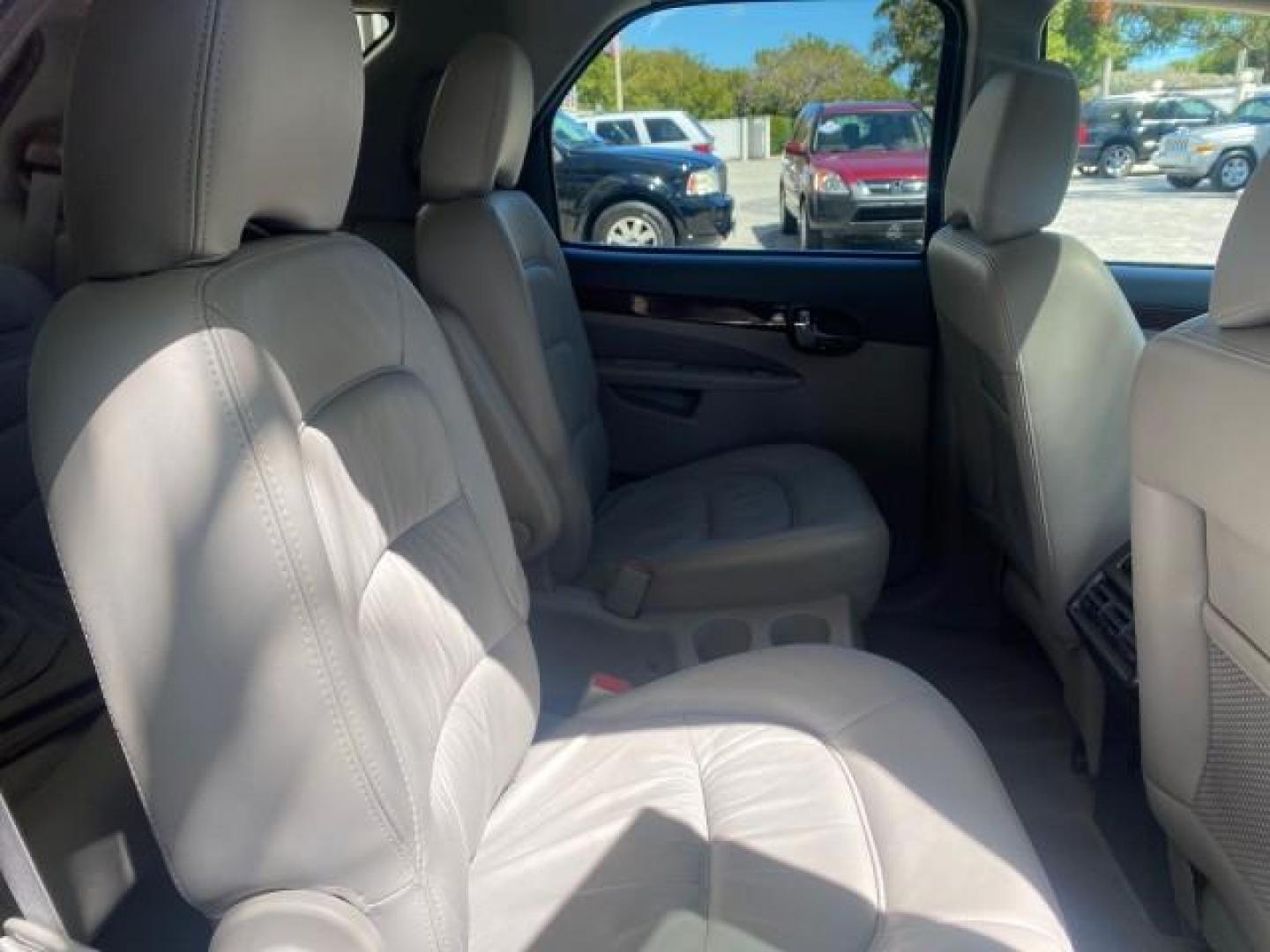 2007 Black Onyx /Gray Buick Rendezvous CXL LOW MILES 33,014 3RD ROW (3G5DA03L47S) with an 3.5L V6 SFI Engine engine, Automatic transmission, located at 4701 North Dixie Hwy, Pompano Beach, FL, 33064, (954) 422-2889, 26.240938, -80.123474 - OUR WEBPAGE FLORIDACARS1.COM HAS OVER 100 PHOTOS AND FREE CARFAX LINK 2007 BUICK RENDEZVOUS CXL NEW $32,314 VIN: 3G5DA03L47S575376 3 G 5 D A 0 3 L 4 7 S 5 7 5 3 7 6 4 DOOR WAGON/SPORT UTILITY 3.5L V6 F 17 INCH CHROME RIMS GASOLINE FRONT WHEEL DRIVE Highlighted Features Heated Seats Leather Seats AM/ - Photo#88