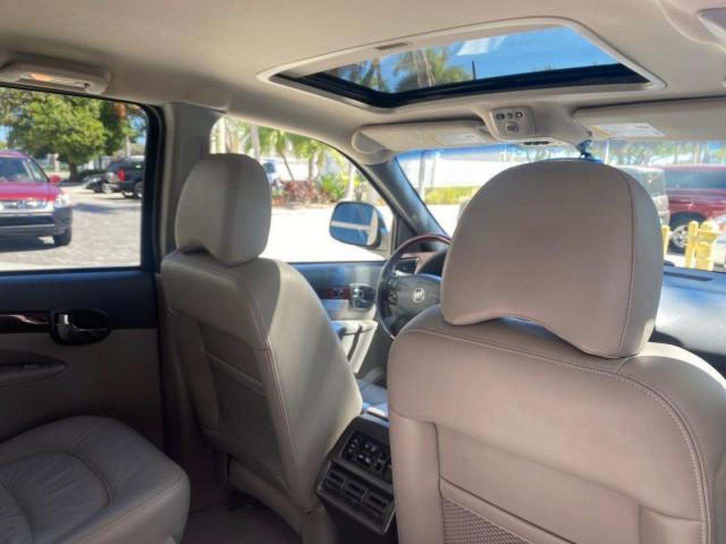 2007 Black Onyx /Gray Buick Rendezvous CXL LOW MILES 33,014 3RD ROW (3G5DA03L47S) with an 3.5L V6 SFI Engine engine, Automatic transmission, located at 4701 North Dixie Hwy, Pompano Beach, FL, 33064, (954) 422-2889, 26.240938, -80.123474 - OUR WEBPAGE FLORIDACARS1.COM HAS OVER 100 PHOTOS AND FREE CARFAX LINK 2007 BUICK RENDEZVOUS CXL NEW $32,314 VIN: 3G5DA03L47S575376 3 G 5 D A 0 3 L 4 7 S 5 7 5 3 7 6 4 DOOR WAGON/SPORT UTILITY 3.5L V6 F 17 INCH CHROME RIMS GASOLINE FRONT WHEEL DRIVE Highlighted Features Heated Seats Leather Seats AM/ - Photo#90
