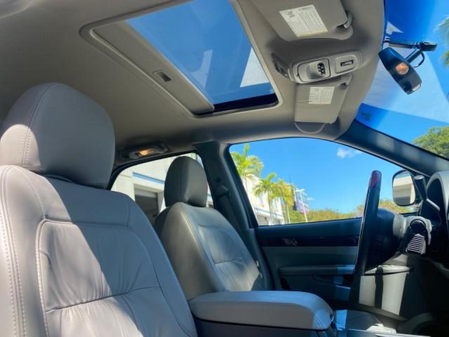 2007 Black Onyx /Gray Buick Rendezvous CXL LOW MILES 33,014 3RD ROW (3G5DA03L47S) with an 3.5L V6 SFI Engine engine, Automatic transmission, located at 4701 North Dixie Hwy, Pompano Beach, FL, 33064, (954) 422-2889, 26.240938, -80.123474 - OUR WEBPAGE FLORIDACARS1.COM HAS OVER 100 PHOTOS AND FREE CARFAX LINK 2007 BUICK RENDEZVOUS CXL NEW $32,314 VIN: 3G5DA03L47S575376 3 G 5 D A 0 3 L 4 7 S 5 7 5 3 7 6 4 DOOR WAGON/SPORT UTILITY 3.5L V6 F 17 INCH CHROME RIMS GASOLINE FRONT WHEEL DRIVE Highlighted Features Heated Seats Leather Seats AM/ - Photo#97