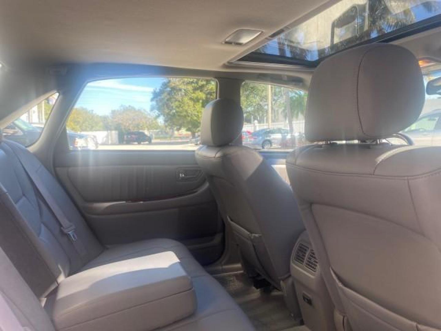 2003 Silver Spruce Metallic /Stone Toyota Avalon XLS 1 FL LOW MILES 32,452 (4T1BF28B03U) with an 3.0L DOHC MPFI 24-Valve V6 Engine engine, Automatic transmission, located at 4701 North Dixie Hwy, Pompano Beach, FL, 33064, (954) 422-2889, 26.240938, -80.123474 - OUR WEBPAGE FLORIDACARS1.COM HAS OVER 100 PHOTOS AND FREE CARFAX LINK 2003 TOYOTA AVALON XLS BUCKET LEATHER SEATS ! VIN: 4T1BF28B03U273831 4 T 1 B F 2 8 B 0 3 U 2 7 3 8 3 1 SEDAN 4 DR 3.0L V6 F DOHC 24V GASOLINE 29 MPG FRONT WHEEL DRIVE TIRES LOOK LIKE NEW ! Top Features Alloy Wheels Luxury Package - Photo#83