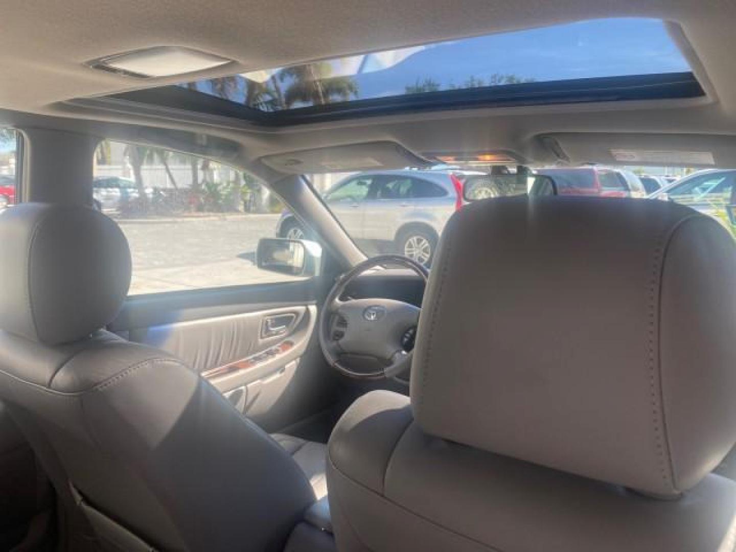 2003 Silver Spruce Metallic /Stone Toyota Avalon XLS 1 FL LOW MILES 32,452 (4T1BF28B03U) with an 3.0L DOHC MPFI 24-Valve V6 Engine engine, Automatic transmission, located at 4701 North Dixie Hwy, Pompano Beach, FL, 33064, (954) 422-2889, 26.240938, -80.123474 - OUR WEBPAGE FLORIDACARS1.COM HAS OVER 100 PHOTOS AND FREE CARFAX LINK 2003 TOYOTA AVALON XLS BUCKET LEATHER SEATS ! VIN: 4T1BF28B03U273831 4 T 1 B F 2 8 B 0 3 U 2 7 3 8 3 1 SEDAN 4 DR 3.0L V6 F DOHC 24V GASOLINE 29 MPG FRONT WHEEL DRIVE TIRES LOOK LIKE NEW ! Top Features Alloy Wheels Luxury Package - Photo#85