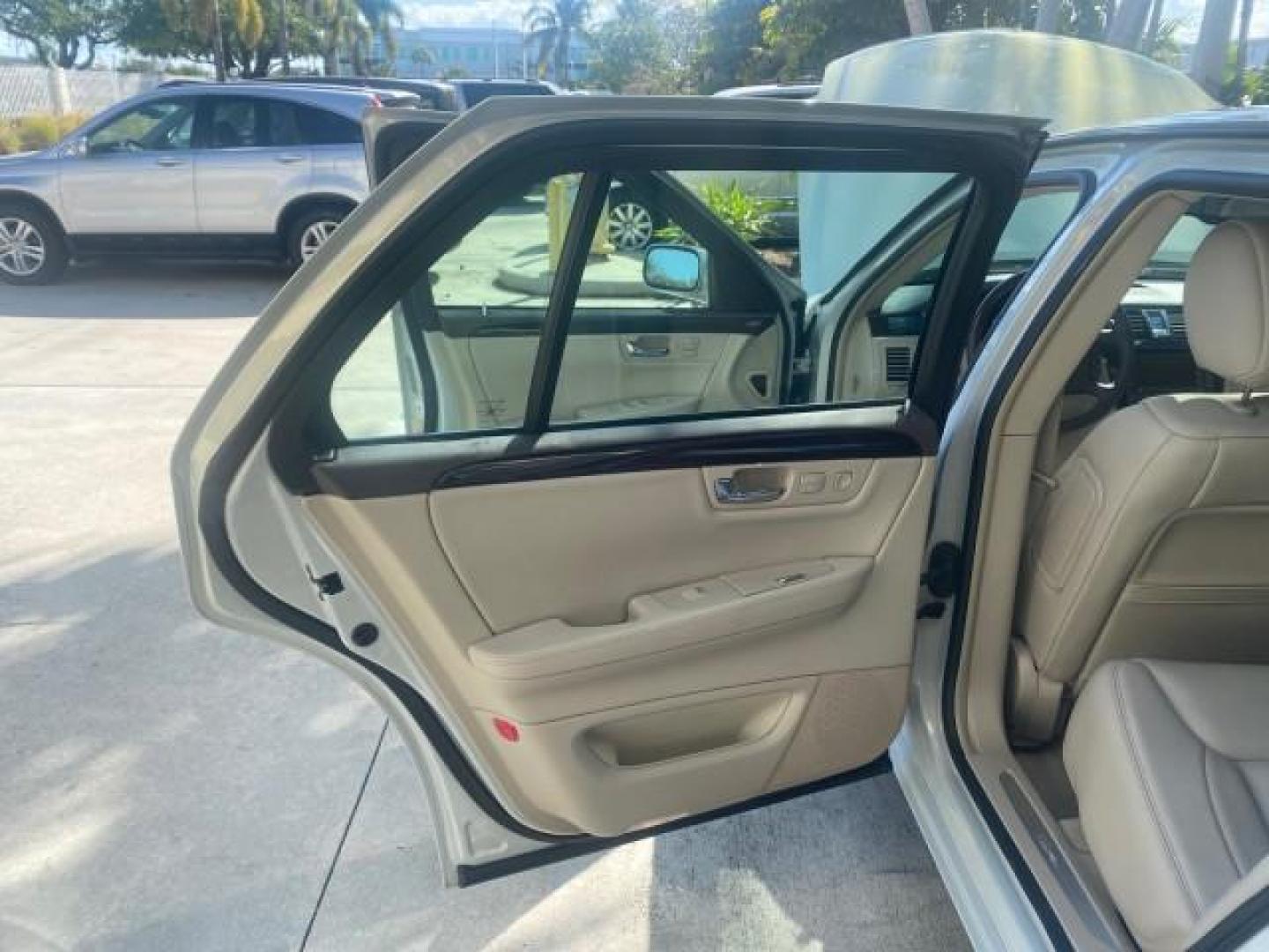 2010 Ocean Pearl Tricoat /Shale/Cocoa Cadillac DTS LOW MILES 39,495 NAV SUNROOF (1G6KH5EY7AU) with an Northstar 4.6L DOHC V8 Engine engine, Automatic transmission, located at 4701 North Dixie Hwy, Pompano Beach, FL, 33064, (954) 422-2889, 26.240938, -80.123474 - OUR WEBPAGE FLORIDACARS1.COM HAS OVER 100 PHOTOS AND FREE CARFAX LINK 2010 CADILLAC DTS PREMIUM COLLECTION $ 56,425 NEW VIN: 1G6KH5EY7AU102292 1 G 6 K H 5 E Y 7 A U 1 0 2 2 9 2 SEDAN 4 DR 4.6L V8 F DOHC 32V GASOLINE FRONT WHEEL DRIVE Top Features A/C Seat(s) Navigation System Alloy Wheels Parking Se - Photo#13