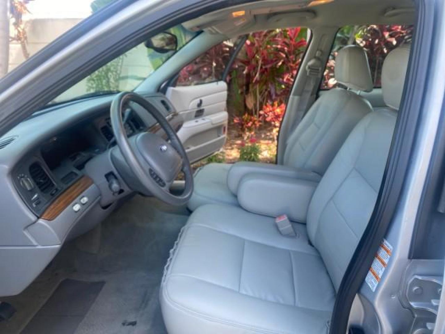 2003 Light Grey /Light Flint Ford Crown Victoria LX 1 OWNER SC LOW MILES 65,833 (2FAHP74W53X) with an 4.6L SEFI OHC V8 Engine engine, Automatic transmission, located at 4701 North Dixie Hwy, Pompano Beach, FL, 33064, (954) 422-2889, 26.240938, -80.123474 - OUR WEBPAGE FLORIDACARS1.COM HAS OVER 100 PHOTOS AND FREE CARFAX LINK 2003 FORD CROWN VICTORIA LX LEATHER VIN: 2FAHP74W53X149974 2 F A H P 7 4 W 5 3 X 1 4 9 9 7 4 SEDAN 4 DR DIGITAL DASH POWER SEATS BOTH SIDES 4.6L V8 F GASOLINE REAR WHEEL DRIVE Top Features Alloy Wheels Cloth Seats Basic Features A - Photo#34