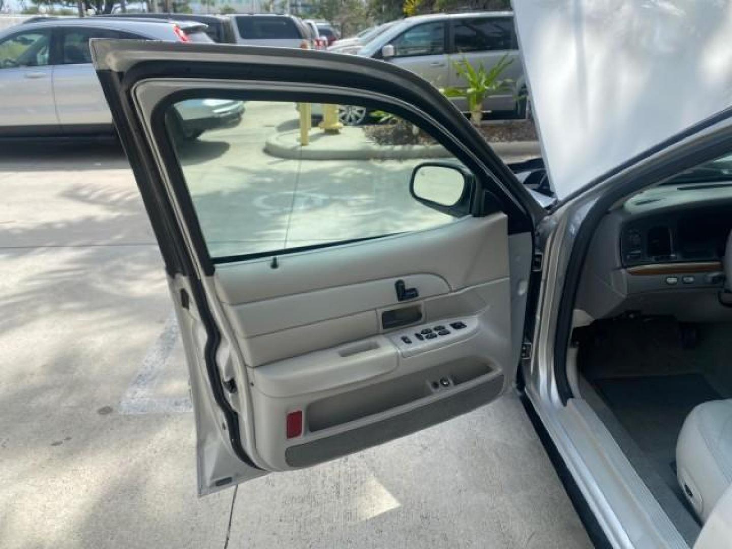 2003 Light Grey /Light Flint Ford Crown Victoria LX 1 OWNER SC LOW MILES 65,833 (2FAHP74W53X) with an 4.6L SEFI OHC V8 Engine engine, Automatic transmission, located at 4701 North Dixie Hwy, Pompano Beach, FL, 33064, (954) 422-2889, 26.240938, -80.123474 - OUR WEBPAGE FLORIDACARS1.COM HAS OVER 100 PHOTOS AND FREE CARFAX LINK 2003 FORD CROWN VICTORIA LX LEATHER VIN: 2FAHP74W53X149974 2 F A H P 7 4 W 5 3 X 1 4 9 9 7 4 SEDAN 4 DR DIGITAL DASH POWER SEATS BOTH SIDES 4.6L V8 F GASOLINE REAR WHEEL DRIVE Top Features Alloy Wheels Cloth Seats Basic Features A - Photo#9
