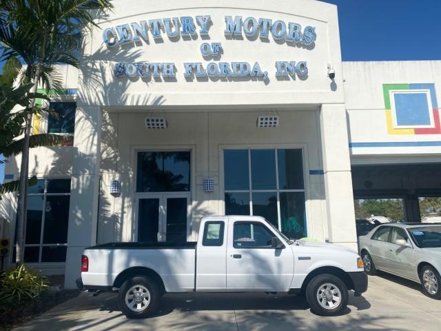 2010 Oxford White /Medium Dark Flint Ford Ranger XL 1 OWNER AC LOW MILES 84,277 (1FTKR1ED3AP) with an 2.3L DOHC 16-Valve I4 Engine engine, Automatic transmission, located at 4701 North Dixie Hwy, Pompano Beach, FL, 33064, (954) 422-2889, 26.240938, -80.123474 - OUR WEBPAGE FLORIDACARS1.COM HAS OVER 100 PHOTOS AND FREE CARFAX LINK 2010 FORD RANGER XL VIN: 1FTKR1ED3APA10031 1 F T K R 1 E D 3 A P A 1 0 0 3 1 CLUB CAB PICKUP 2.3L I4 F DOHC 16V GASOLINE REAR WHEEL DRIVE Top Features Bed Liner Tow Hitch Cloth Seats Basic Features ABS Brakes Air Conditioning Side - Photo#0