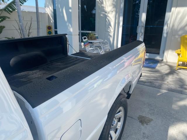 2010 Oxford White /Medium Dark Flint Ford Ranger XL 1 OWNER AC LOW MILES 84,277 (1FTKR1ED3AP) with an 2.3L DOHC 16-Valve I4 Engine engine, Automatic transmission, located at 4701 North Dixie Hwy, Pompano Beach, FL, 33064, (954) 422-2889, 26.240938, -80.123474 - OUR WEBPAGE FLORIDACARS1.COM HAS OVER 100 PHOTOS AND FREE CARFAX LINK 2010 FORD RANGER XL VIN: 1FTKR1ED3APA10031 1 F T K R 1 E D 3 A P A 1 0 0 3 1 CLUB CAB PICKUP 2.3L I4 F DOHC 16V GASOLINE REAR WHEEL DRIVE Top Features Bed Liner Tow Hitch Cloth Seats Basic Features ABS Brakes Air Conditioning Side - Photo#62