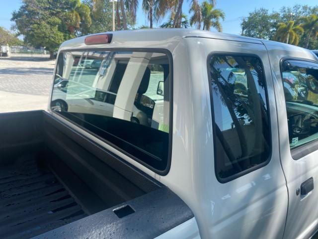 2010 Oxford White /Medium Dark Flint Ford Ranger XL 1 OWNER AC LOW MILES 84,277 (1FTKR1ED3AP) with an 2.3L DOHC 16-Valve I4 Engine engine, Automatic transmission, located at 4701 North Dixie Hwy, Pompano Beach, FL, 33064, (954) 422-2889, 26.240938, -80.123474 - OUR WEBPAGE FLORIDACARS1.COM HAS OVER 100 PHOTOS AND FREE CARFAX LINK 2010 FORD RANGER XL VIN: 1FTKR1ED3APA10031 1 F T K R 1 E D 3 A P A 1 0 0 3 1 CLUB CAB PICKUP 2.3L I4 F DOHC 16V GASOLINE REAR WHEEL DRIVE Top Features Bed Liner Tow Hitch Cloth Seats Basic Features ABS Brakes Air Conditioning Side - Photo#84