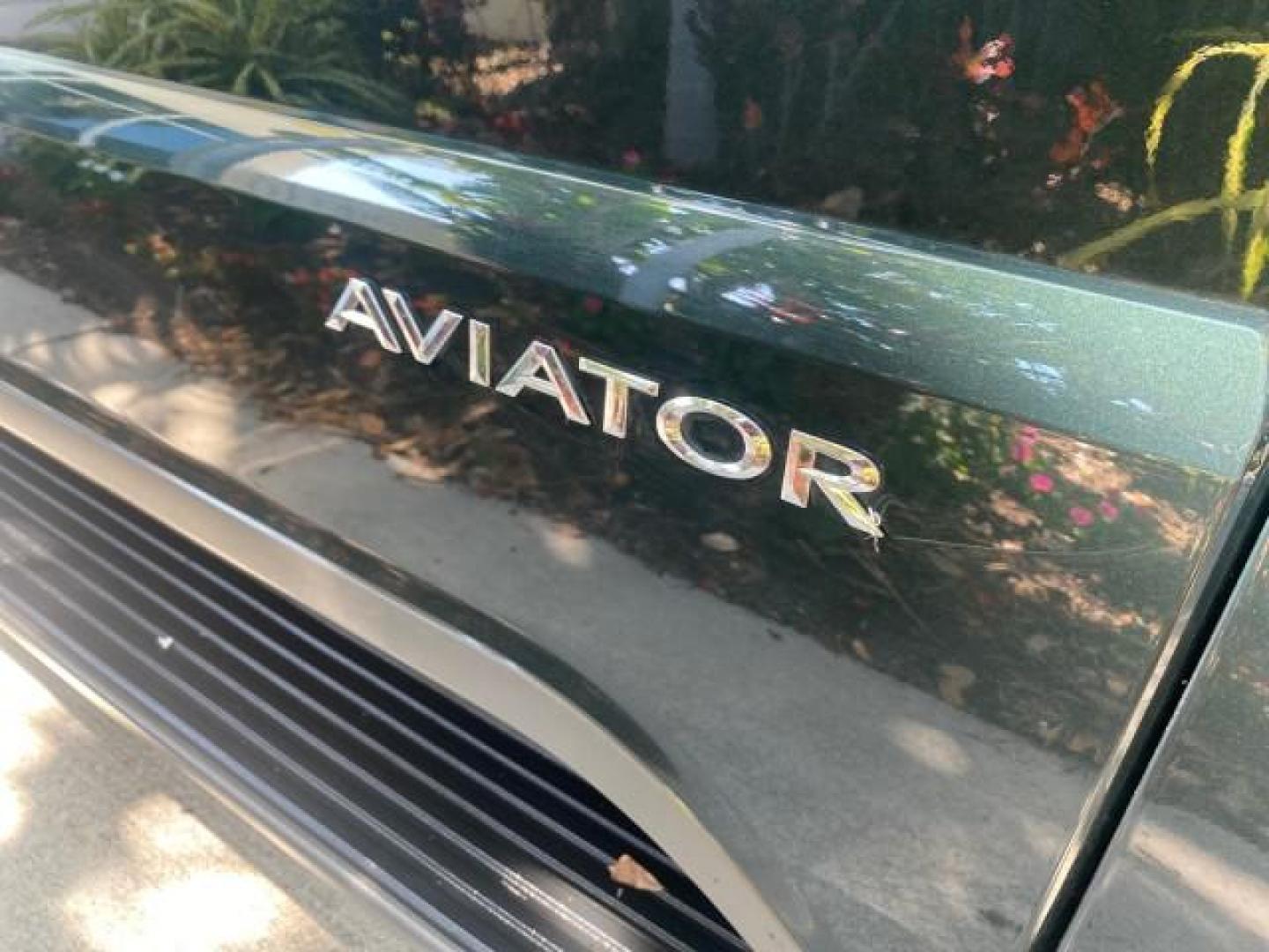 2003 Aspen Green Metallic /Light Parchment Lincoln Aviator Premium SUNROOF LEATHER NAV (5LMEU68H43Z) with an 4.6L DOHC 32-Valve V8 Engine engine, Automatic transmission, located at 4701 North Dixie Hwy, Pompano Beach, FL, 33064, (954) 422-2889, 26.240938, -80.123474 - OUR WEBPAGE FLORIDACARS1.COM HAS OVER 100 PHOTOS AND FREE CARFAX LINK 2003 LINCOLN AVIATOR PREMIUM NAV VIN: 5LMEU68H43ZJ52878 5 L M E U 6 8 H 4 3 Z J 5 2 8 7 8 4 DOOR WAGON/SPORT UTILITY 4.6L V8 F DOHC GASOLINE REAR WHEEL DRIVE Top Features Alloy Wheels Rear View Camera Fold-Away Third Row Running B - Photo#24