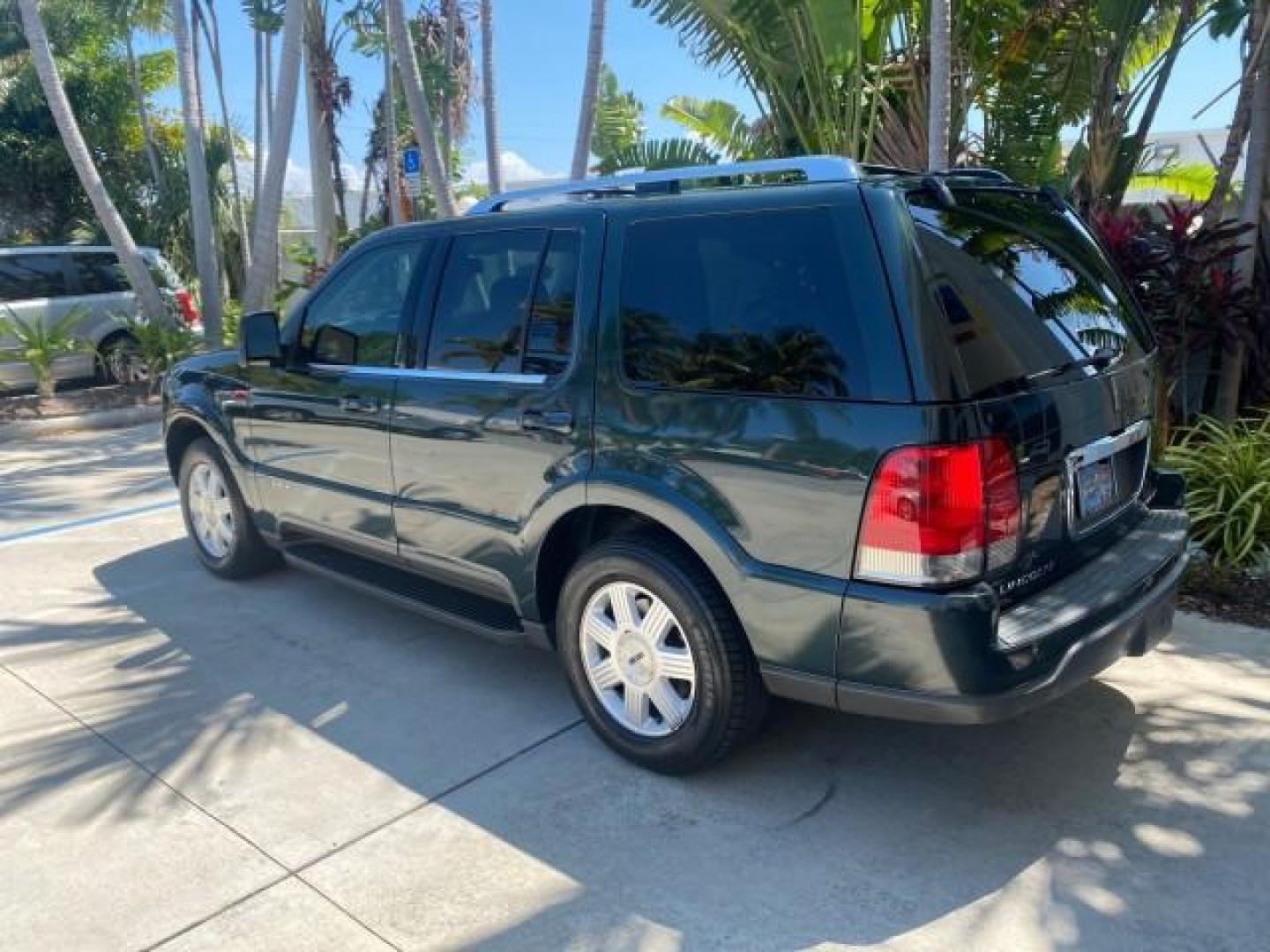 2003 Aspen Green Metallic /Light Parchment Lincoln Aviator Premium SUNROOF LEATHER NAV (5LMEU68H43Z) with an 4.6L DOHC 32-Valve V8 Engine engine, Automatic transmission, located at 4701 North Dixie Hwy, Pompano Beach, FL, 33064, (954) 422-2889, 26.240938, -80.123474 - OUR WEBPAGE FLORIDACARS1.COM HAS OVER 100 PHOTOS AND FREE CARFAX LINK 2003 LINCOLN AVIATOR PREMIUM NAV VIN: 5LMEU68H43ZJ52878 5 L M E U 6 8 H 4 3 Z J 5 2 8 7 8 4 DOOR WAGON/SPORT UTILITY 4.6L V8 F DOHC GASOLINE REAR WHEEL DRIVE Top Features Alloy Wheels Rear View Camera Fold-Away Third Row Running B - Photo#5