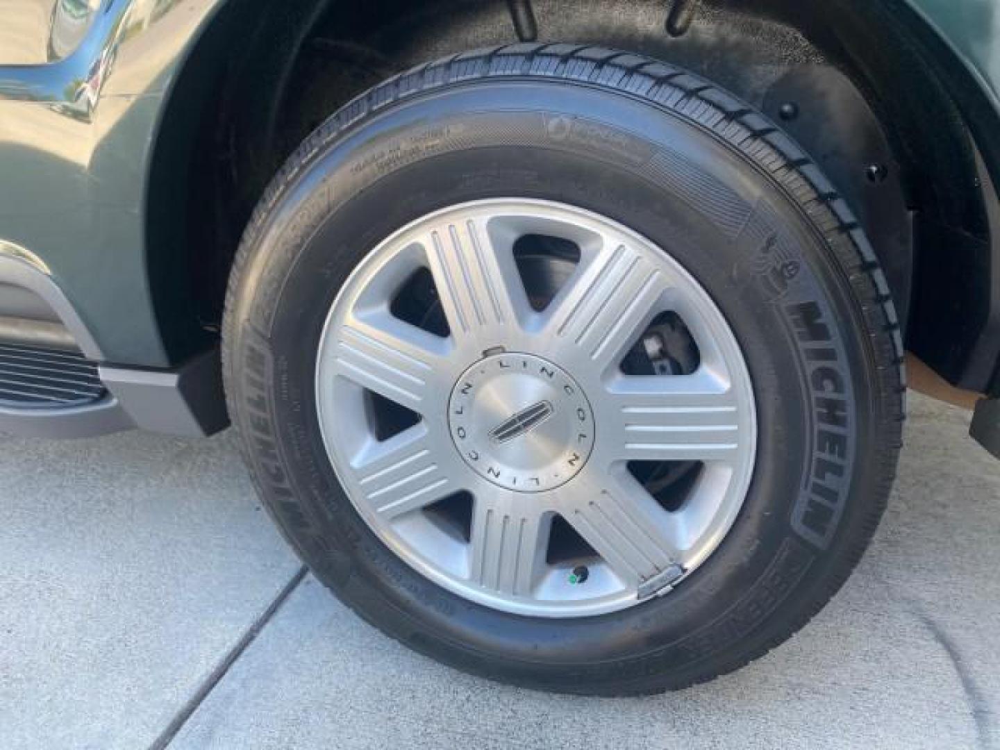 2003 Aspen Green Metallic /Light Parchment Lincoln Aviator Premium SUNROOF LEATHER NAV (5LMEU68H43Z) with an 4.6L DOHC 32-Valve V8 Engine engine, Automatic transmission, located at 4701 North Dixie Hwy, Pompano Beach, FL, 33064, (954) 422-2889, 26.240938, -80.123474 - OUR WEBPAGE FLORIDACARS1.COM HAS OVER 100 PHOTOS AND FREE CARFAX LINK 2003 LINCOLN AVIATOR PREMIUM NAV VIN: 5LMEU68H43ZJ52878 5 L M E U 6 8 H 4 3 Z J 5 2 8 7 8 4 DOOR WAGON/SPORT UTILITY 4.6L V8 F DOHC GASOLINE REAR WHEEL DRIVE Top Features Alloy Wheels Rear View Camera Fold-Away Third Row Running B - Photo#73