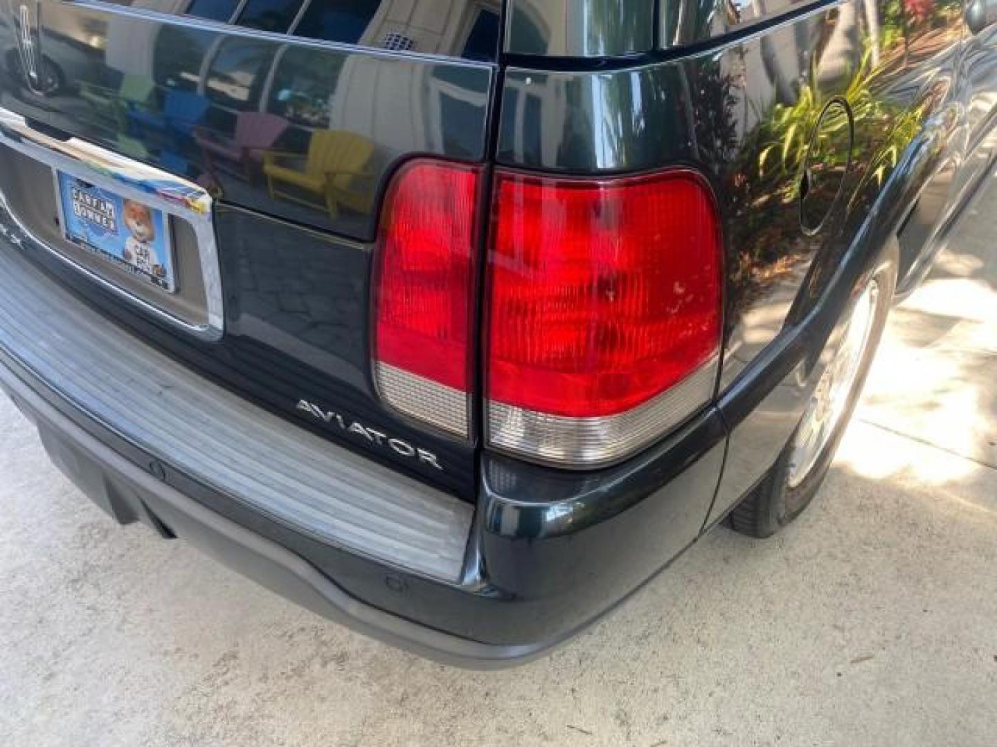 2003 Aspen Green Metallic /Light Parchment Lincoln Aviator Premium SUNROOF LEATHER NAV (5LMEU68H43Z) with an 4.6L DOHC 32-Valve V8 Engine engine, Automatic transmission, located at 4701 North Dixie Hwy, Pompano Beach, FL, 33064, (954) 422-2889, 26.240938, -80.123474 - OUR WEBPAGE FLORIDACARS1.COM HAS OVER 100 PHOTOS AND FREE CARFAX LINK 2003 LINCOLN AVIATOR PREMIUM NAV VIN: 5LMEU68H43ZJ52878 5 L M E U 6 8 H 4 3 Z J 5 2 8 7 8 4 DOOR WAGON/SPORT UTILITY 4.6L V8 F DOHC GASOLINE REAR WHEEL DRIVE Top Features Alloy Wheels Rear View Camera Fold-Away Third Row Running B - Photo#77