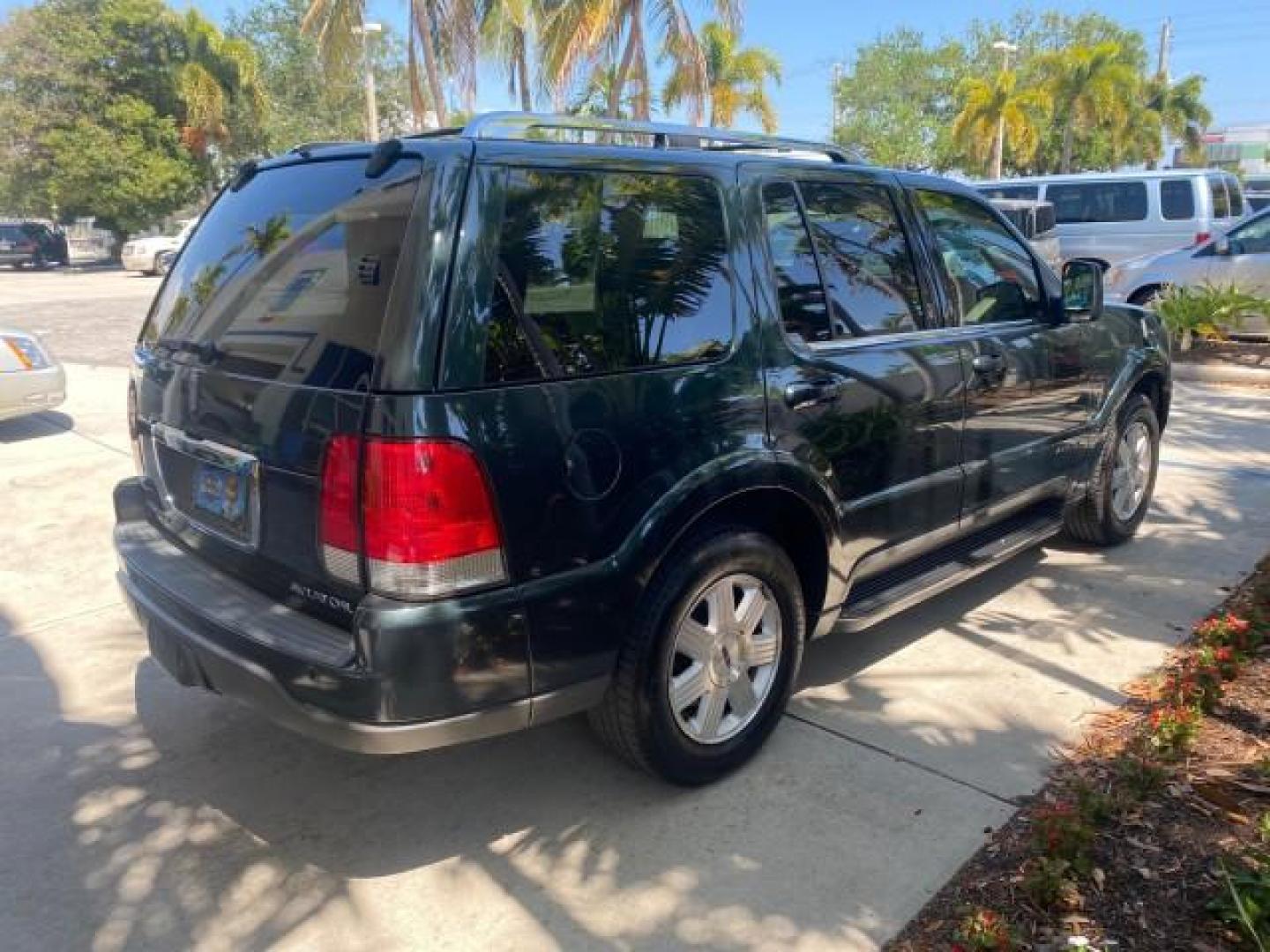 2003 Aspen Green Metallic /Light Parchment Lincoln Aviator Premium SUNROOF LEATHER NAV (5LMEU68H43Z) with an 4.6L DOHC 32-Valve V8 Engine engine, Automatic transmission, located at 4701 North Dixie Hwy, Pompano Beach, FL, 33064, (954) 422-2889, 26.240938, -80.123474 - OUR WEBPAGE FLORIDACARS1.COM HAS OVER 100 PHOTOS AND FREE CARFAX LINK 2003 LINCOLN AVIATOR PREMIUM NAV VIN: 5LMEU68H43ZJ52878 5 L M E U 6 8 H 4 3 Z J 5 2 8 7 8 4 DOOR WAGON/SPORT UTILITY 4.6L V8 F DOHC GASOLINE REAR WHEEL DRIVE Top Features Alloy Wheels Rear View Camera Fold-Away Third Row Running B - Photo#7