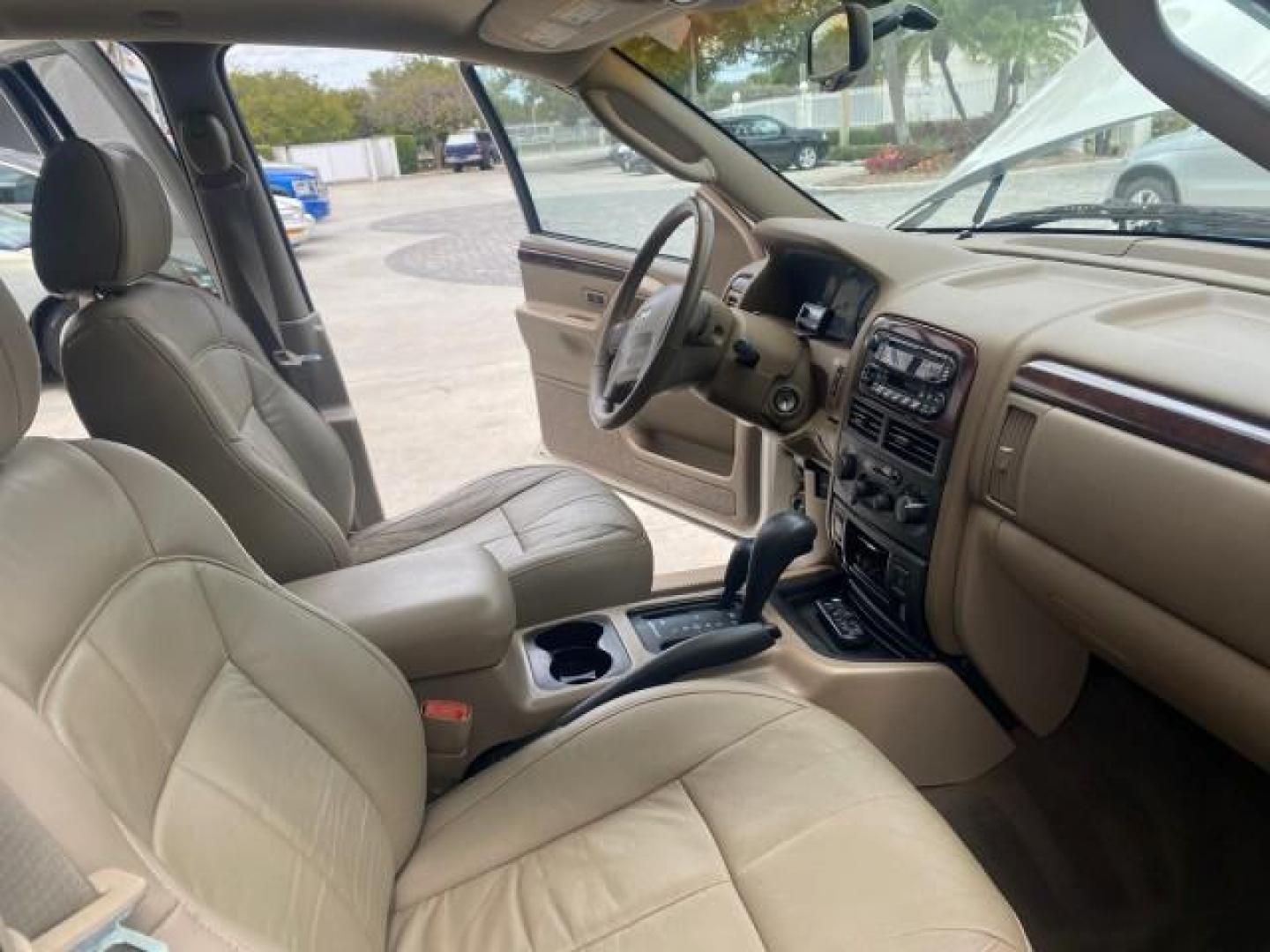 2004 Stone White /Sandstone Jeep Grand Cherokee Limited 4WD SUNROOF (1J8GW58N14C) with an 4.7L 8-Cyl Engine engine, Automatic transmission, located at 4701 North Dixie Hwy, Pompano Beach, FL, 33064, (954) 422-2889, 26.240938, -80.123474 - OUR WEBPAGE FLORIDACARS1.COM HAS OVER 100 PHOTOS AND FREE CARFAX LINK 2004 JEEP GRAND CHEROKEE LIMITED A TRUE CLASSIC WONT LAST IN STOCK VIN: 1J8GW58N14C199129 1 J 8 G W 5 8 N 1 4 C 1 9 9 1 2 9 4 DOOR WAGON/SPORT UTILITY 4.7L V8 F SOHC TOW PKG AND FRONT TOW HITCH WITH PLUG GASOLINE REAR WHEEL DRIVE - Photo#12