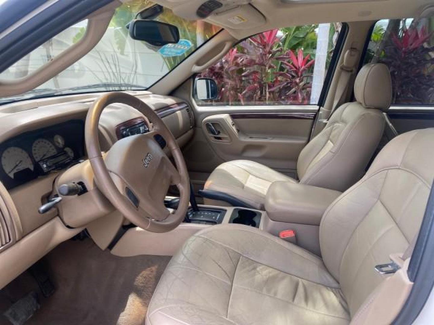 2004 Stone White /Sandstone Jeep Grand Cherokee Limited 4WD SUNROOF (1J8GW58N14C) with an 4.7L 8-Cyl Engine engine, Automatic transmission, located at 4701 North Dixie Hwy, Pompano Beach, FL, 33064, (954) 422-2889, 26.240938, -80.123474 - OUR WEBPAGE FLORIDACARS1.COM HAS OVER 100 PHOTOS AND FREE CARFAX LINK 2004 JEEP GRAND CHEROKEE LIMITED A TRUE CLASSIC WONT LAST IN STOCK VIN: 1J8GW58N14C199129 1 J 8 G W 5 8 N 1 4 C 1 9 9 1 2 9 4 DOOR WAGON/SPORT UTILITY 4.7L V8 F SOHC TOW PKG AND FRONT TOW HITCH WITH PLUG GASOLINE REAR WHEEL DRIVE - Photo#32