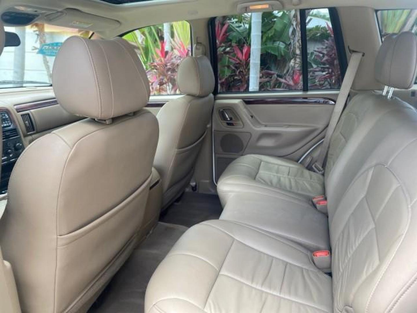 2004 Stone White /Sandstone Jeep Grand Cherokee Limited 4WD SUNROOF (1J8GW58N14C) with an 4.7L 8-Cyl Engine engine, Automatic transmission, located at 4701 North Dixie Hwy, Pompano Beach, FL, 33064, (954) 422-2889, 26.240938, -80.123474 - OUR WEBPAGE FLORIDACARS1.COM HAS OVER 100 PHOTOS AND FREE CARFAX LINK 2004 JEEP GRAND CHEROKEE LIMITED A TRUE CLASSIC WONT LAST IN STOCK VIN: 1J8GW58N14C199129 1 J 8 G W 5 8 N 1 4 C 1 9 9 1 2 9 4 DOOR WAGON/SPORT UTILITY 4.7L V8 F SOHC TOW PKG AND FRONT TOW HITCH WITH PLUG GASOLINE REAR WHEEL DRIVE - Photo#61