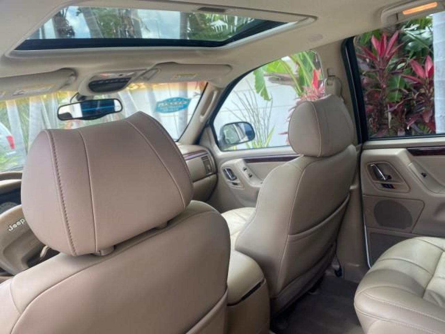2004 Stone White /Sandstone Jeep Grand Cherokee Limited 4WD SUNROOF (1J8GW58N14C) with an 4.7L 8-Cyl Engine engine, Automatic transmission, located at 4701 North Dixie Hwy, Pompano Beach, FL, 33064, (954) 422-2889, 26.240938, -80.123474 - OUR WEBPAGE FLORIDACARS1.COM HAS OVER 100 PHOTOS AND FREE CARFAX LINK 2004 JEEP GRAND CHEROKEE LIMITED A TRUE CLASSIC WONT LAST IN STOCK VIN: 1J8GW58N14C199129 1 J 8 G W 5 8 N 1 4 C 1 9 9 1 2 9 4 DOOR WAGON/SPORT UTILITY 4.7L V8 F SOHC TOW PKG AND FRONT TOW HITCH WITH PLUG GASOLINE REAR WHEEL DRIVE - Photo#63